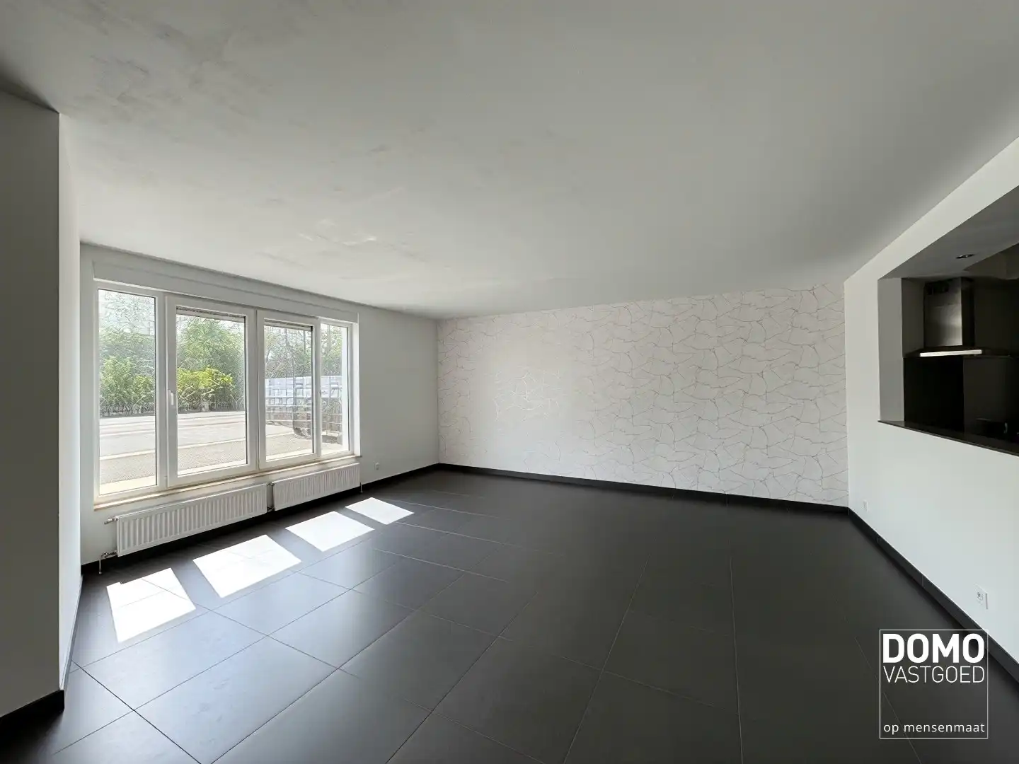 Gelijkvloers appartement met tuin en ondergrondse garage te Kermt - energielabel B -121m² bewoonbare oppervlakte foto 2