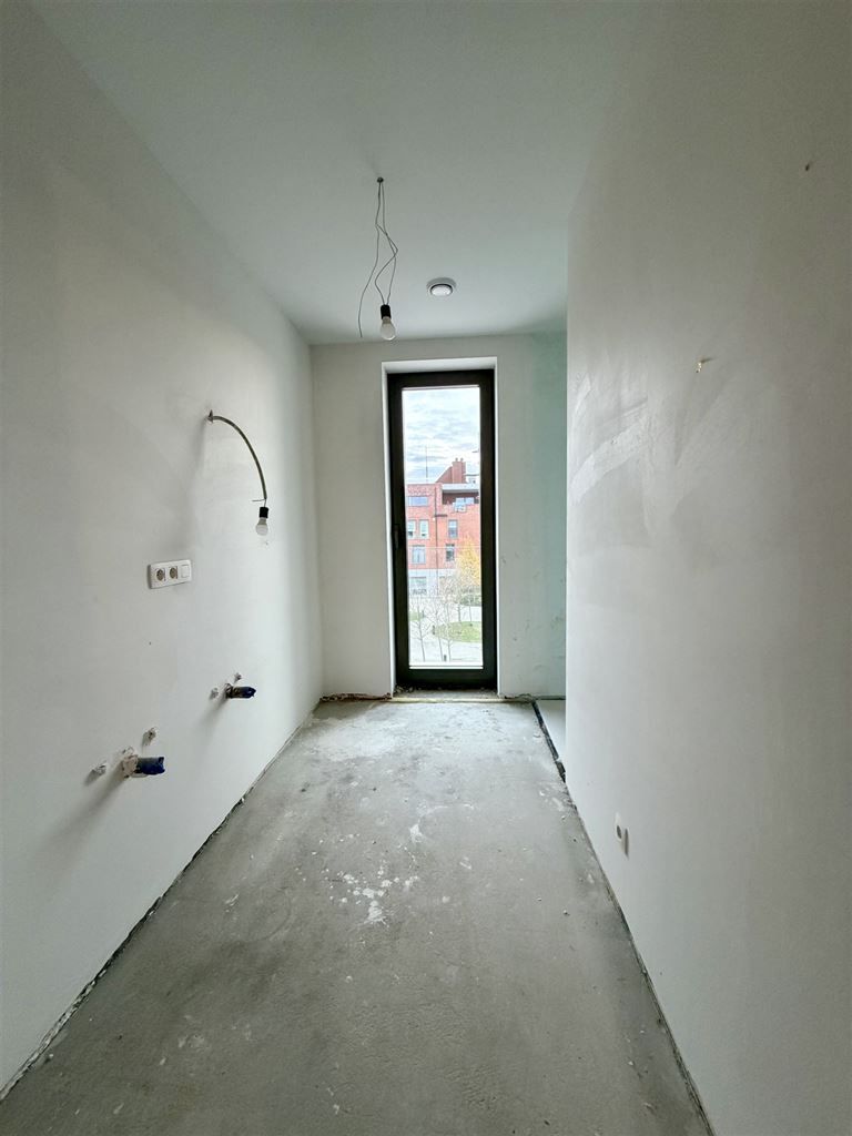 Nieuwbouwappartement op de tweede verdieping met 2 slaapkamers en terras gelegen in het centrum van Dilsen.  foto 8