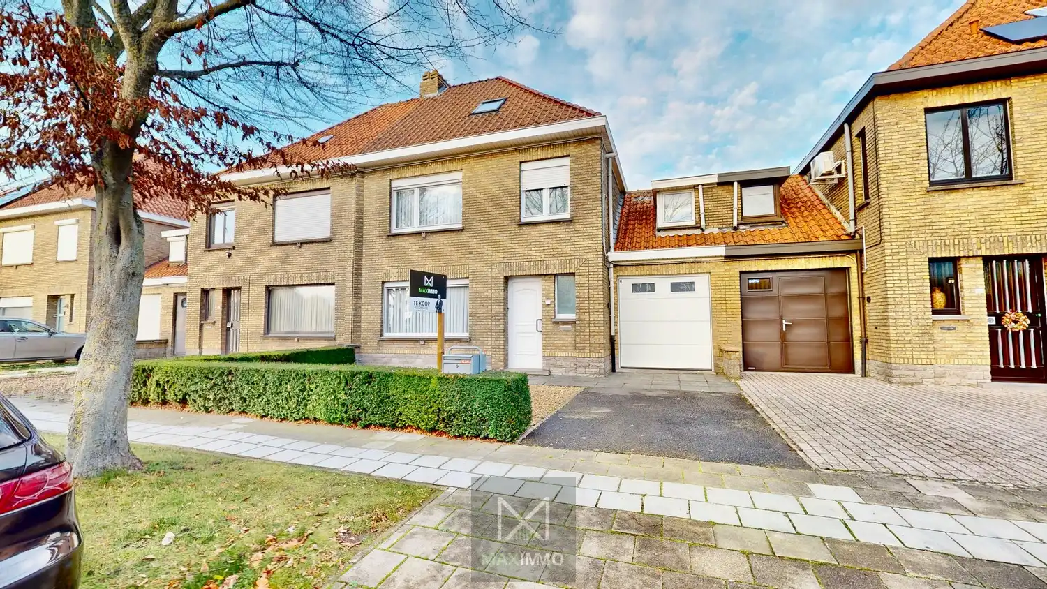 Hoofdfoto van de publicatie: Te renoveren woning met tuin, garage en uitbreidingsmogelijkheden nabij centrum en Leie