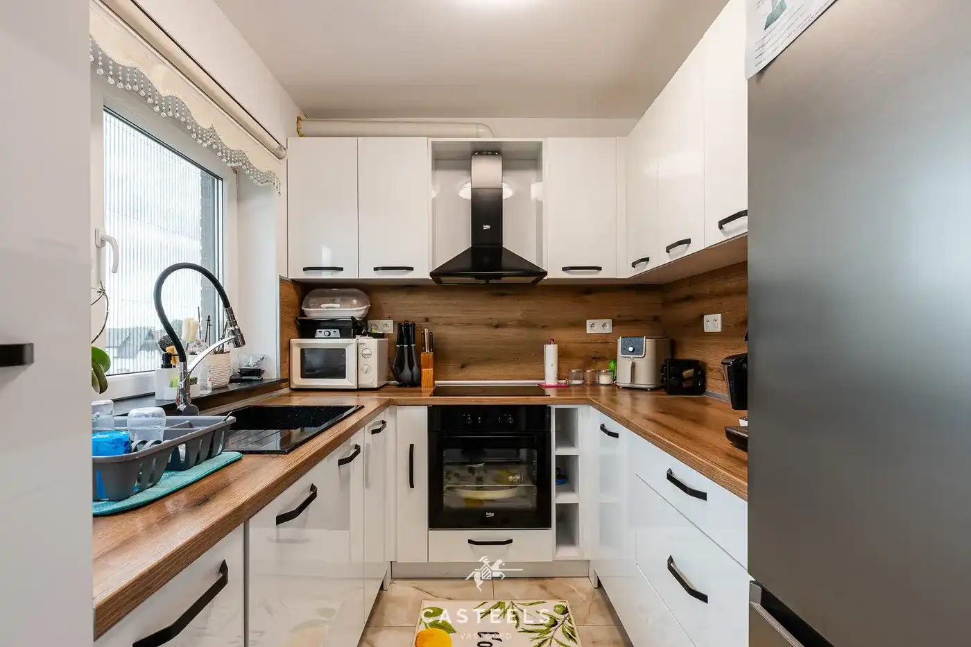 Gerenoveerd duplexappartement met groot terras, garage en 2 slaapkamers in Zelzate foto 4