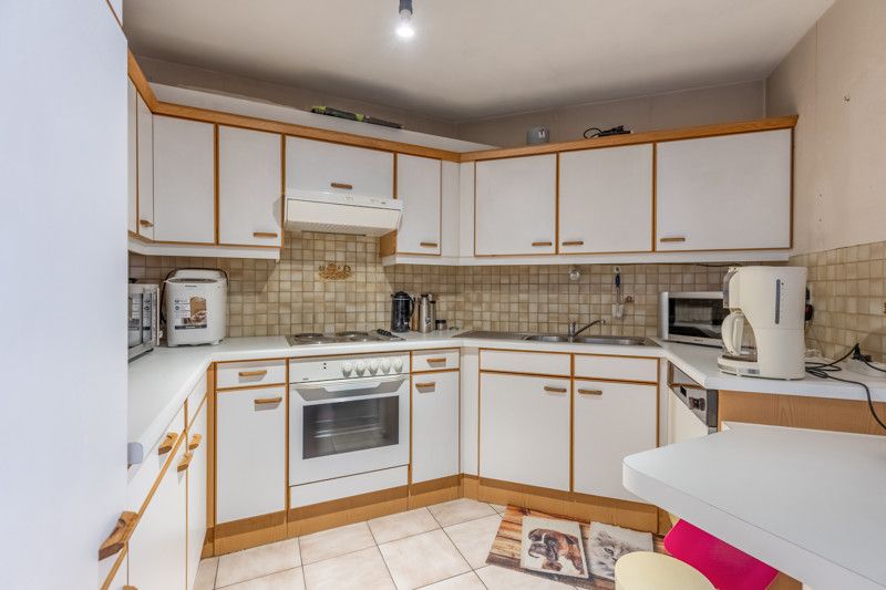 Gelijkvloers appartement met 2 slpkms, autostaanplaats en private berging foto 6