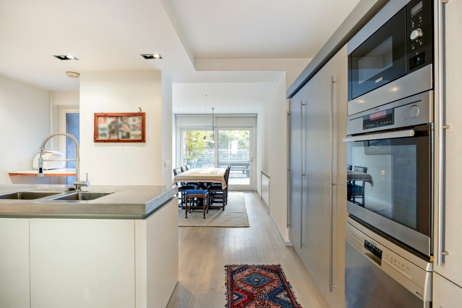 Gelijkvloers appartement met een terras van 50m²,  3 slaapkamers en 2 staanplaatsen in het centrum van Leuven! - bewoonbare opp. 147m²  foto 11