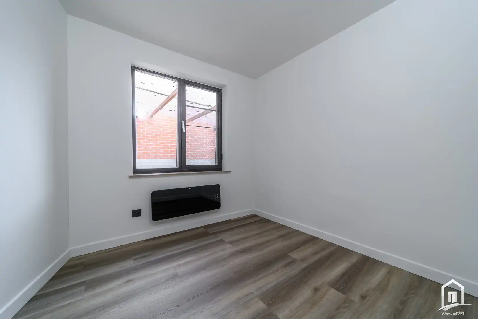 Totaal gerenoveerd gelijkvloers-appartement met tuintje foto 16