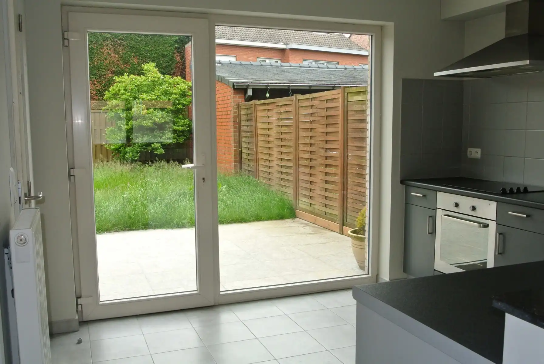 Gezellige gelijkvloers appartement  met 2 slaapkamers + terras en tuintje foto 5