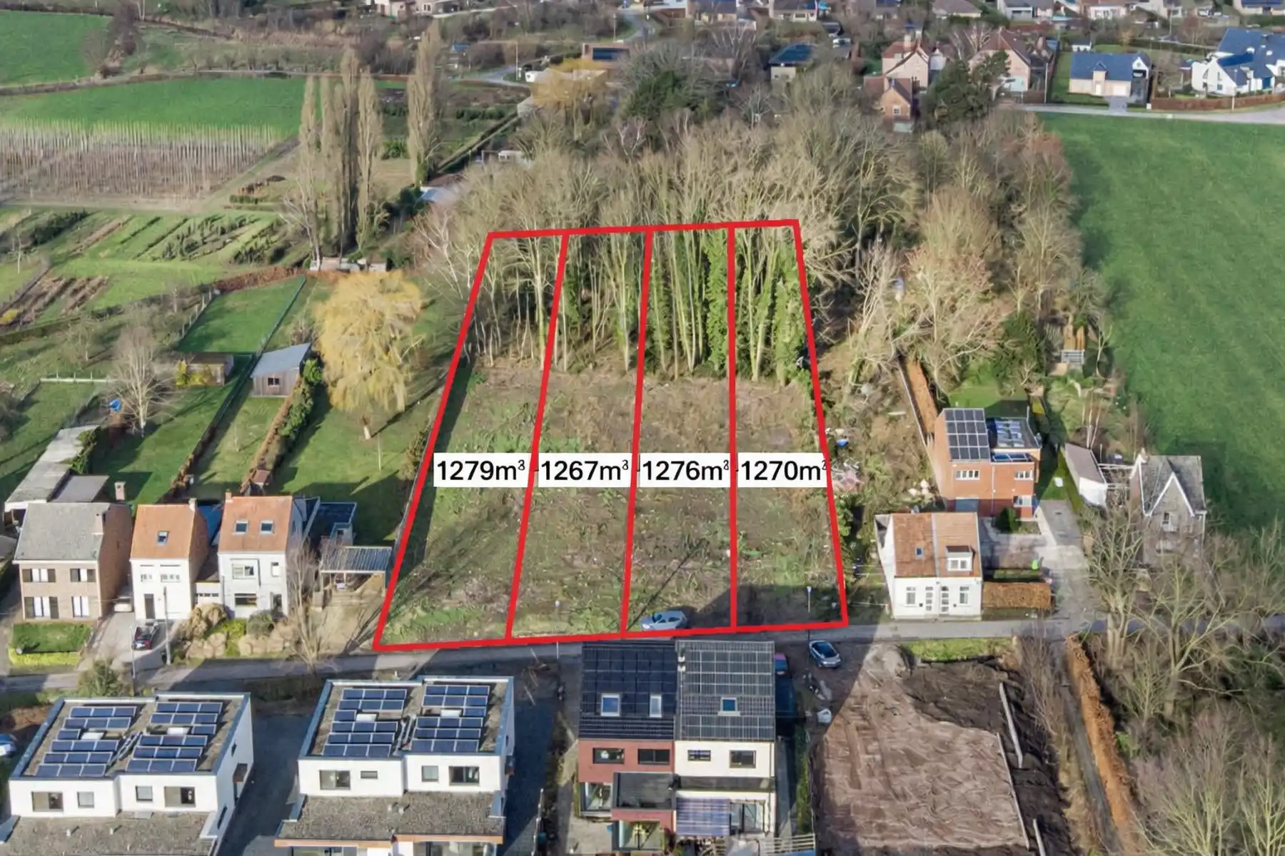 TE KOOP - bouwgrond halfopen bebouwing met stuk bos op 1276m² foto {{pictureIndex}}