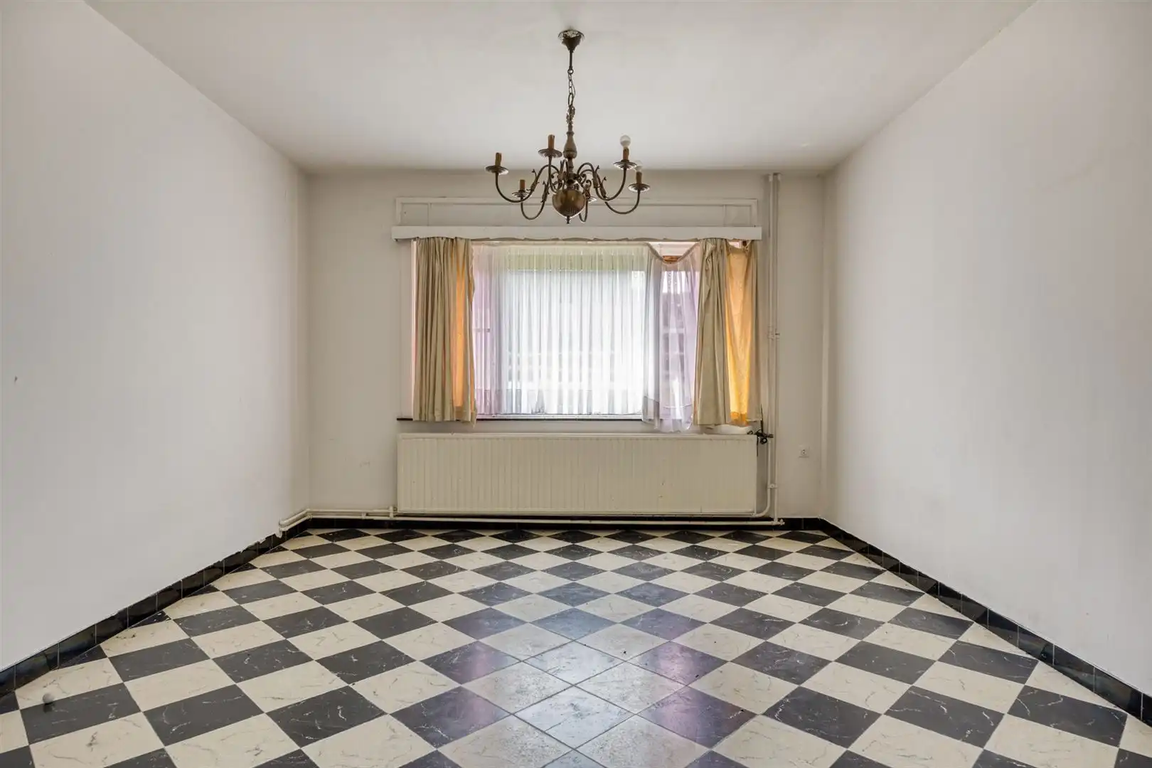 TE KOOP: Te renoveren woning met ruim perceel en projectmogelijkheden in Lummen! foto 5