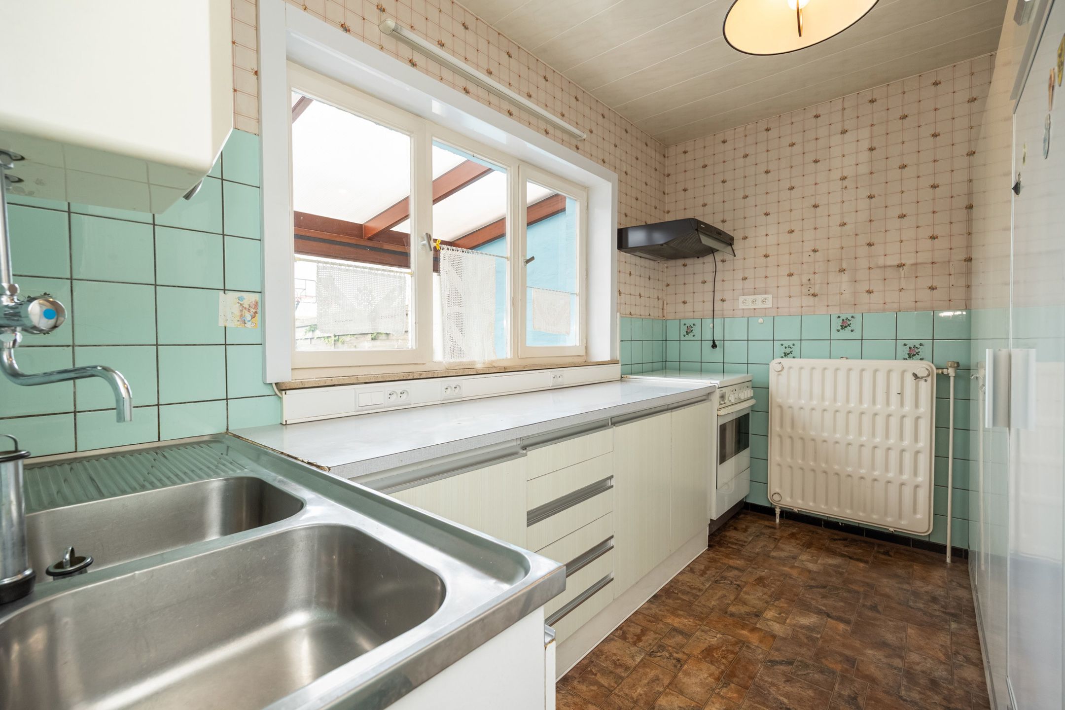 Te renoveren woning met zicht op velden in Grimbergen foto 6