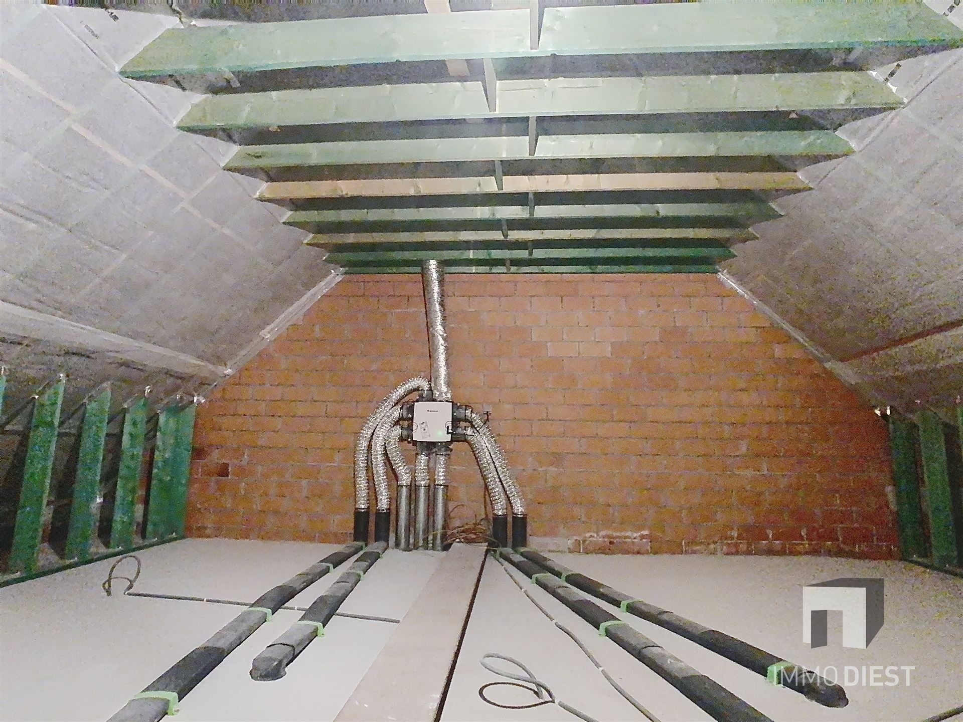 Charmante energiezuinige nieuwbouwwoning met zonnige tuin in hartje Zichem. foto 20