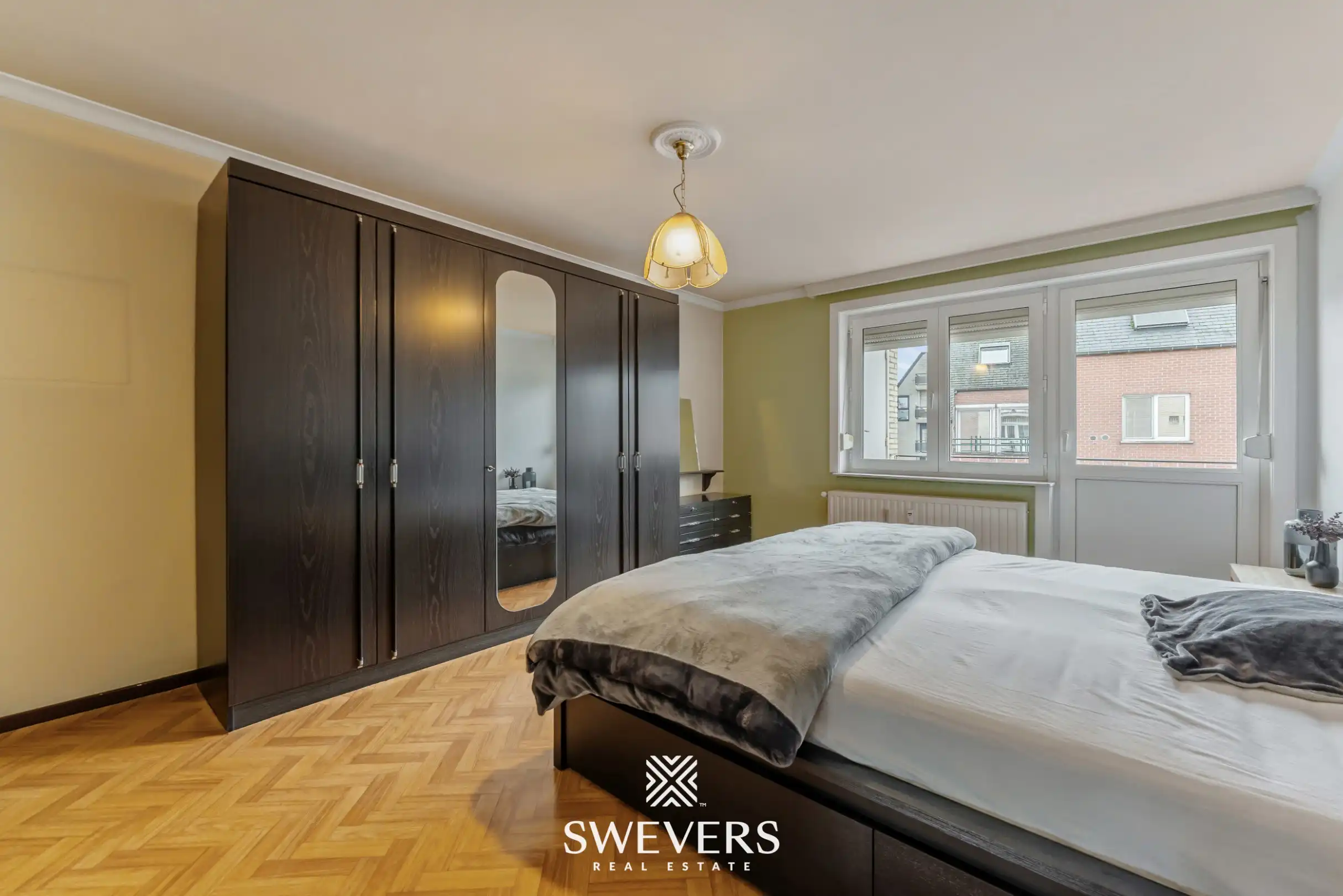 Ruim en lichtrijk 3-slpk appartement met 2 terrasjes in hartje Genk foto 15