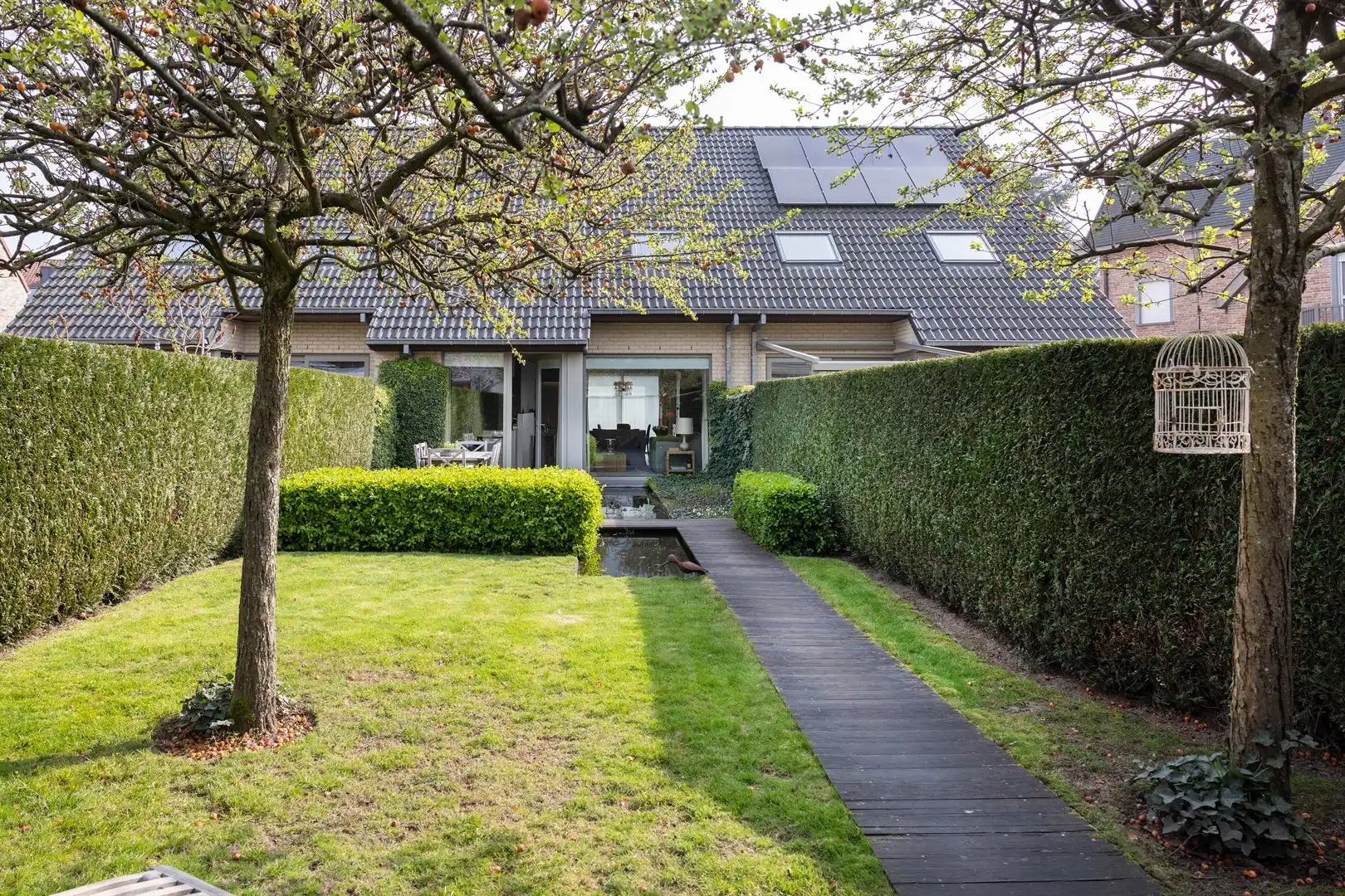 Gezellige stadswoning met zongerichte tuin, garage & parking. foto 14