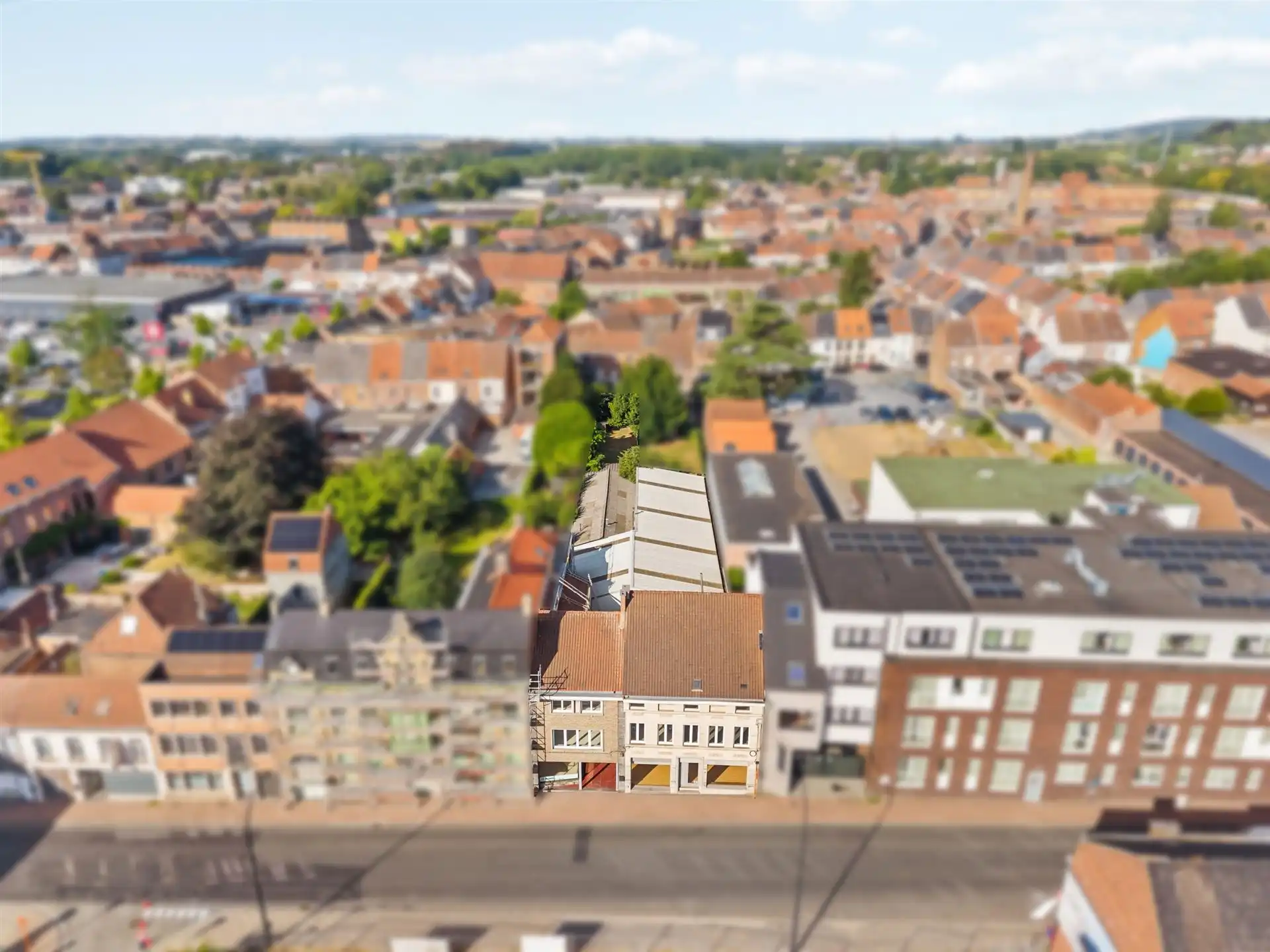 Commercieel gelegen winkel, woonst, magazijn en bouwgrond foto 25