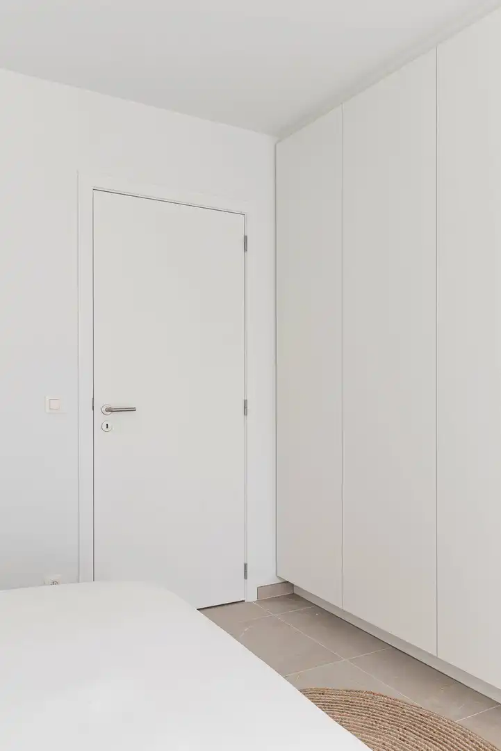 Lichtrijk recent instapklaar appartement met 2 slaapkamers, zonneterras, parking en ruime kelderberging foto 12