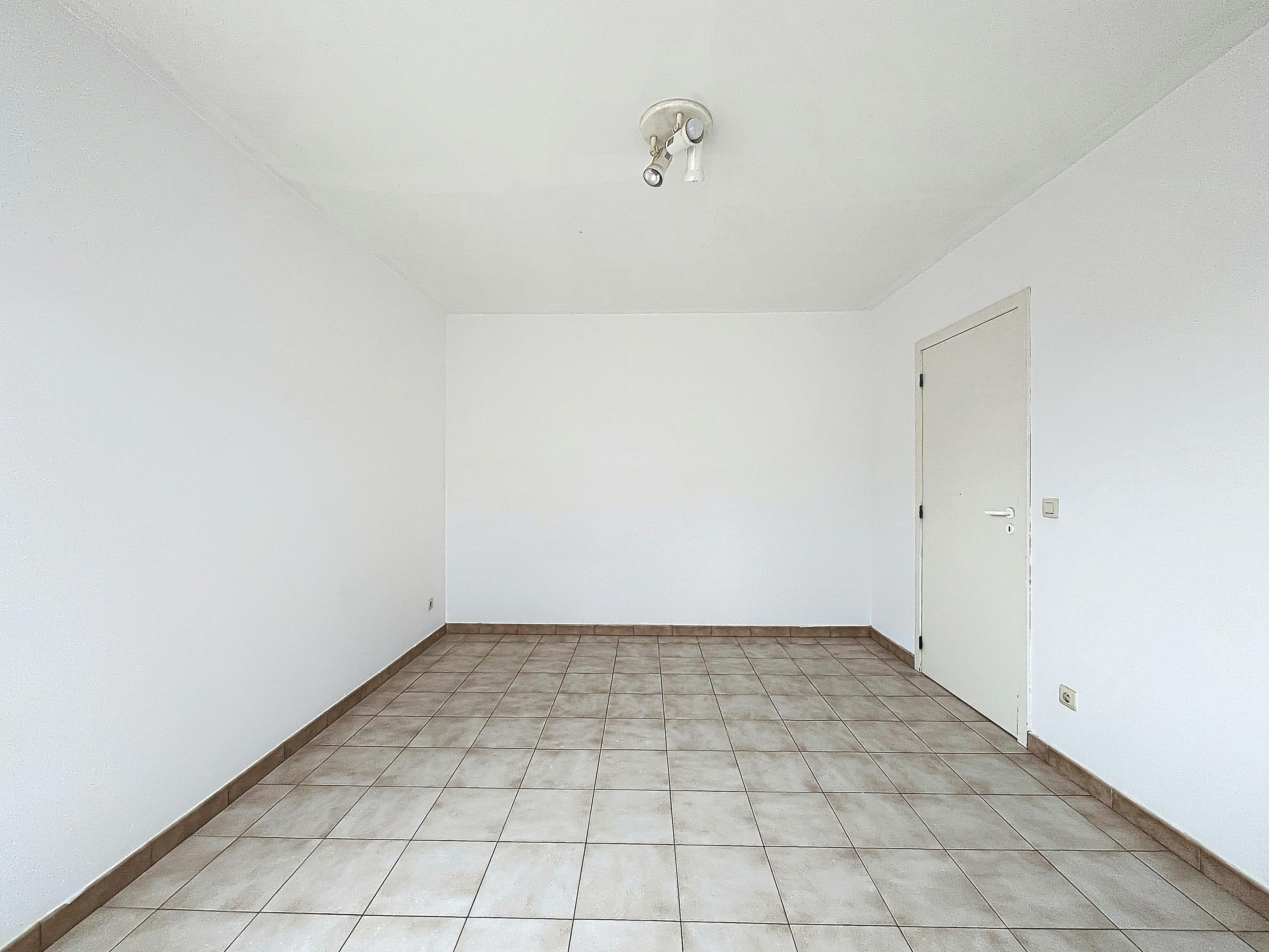 Ruim 1-slaapkamerappartement met garagebox! foto 7