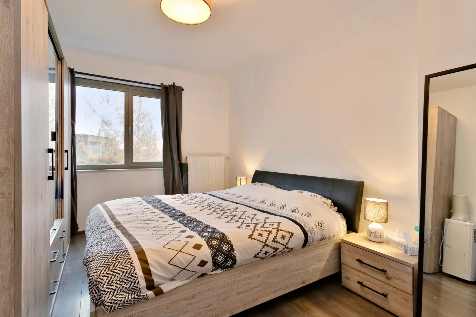 Recent lichtrijk 2slpk-appartement met terras, garagebox en kelder foto 12