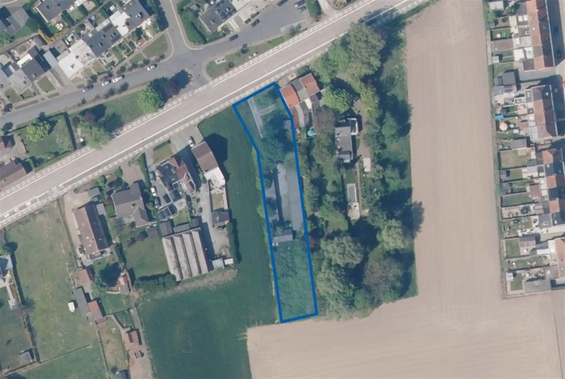 Ideale investering bouwgrond met 20 achterliggende garageboxen foto 2