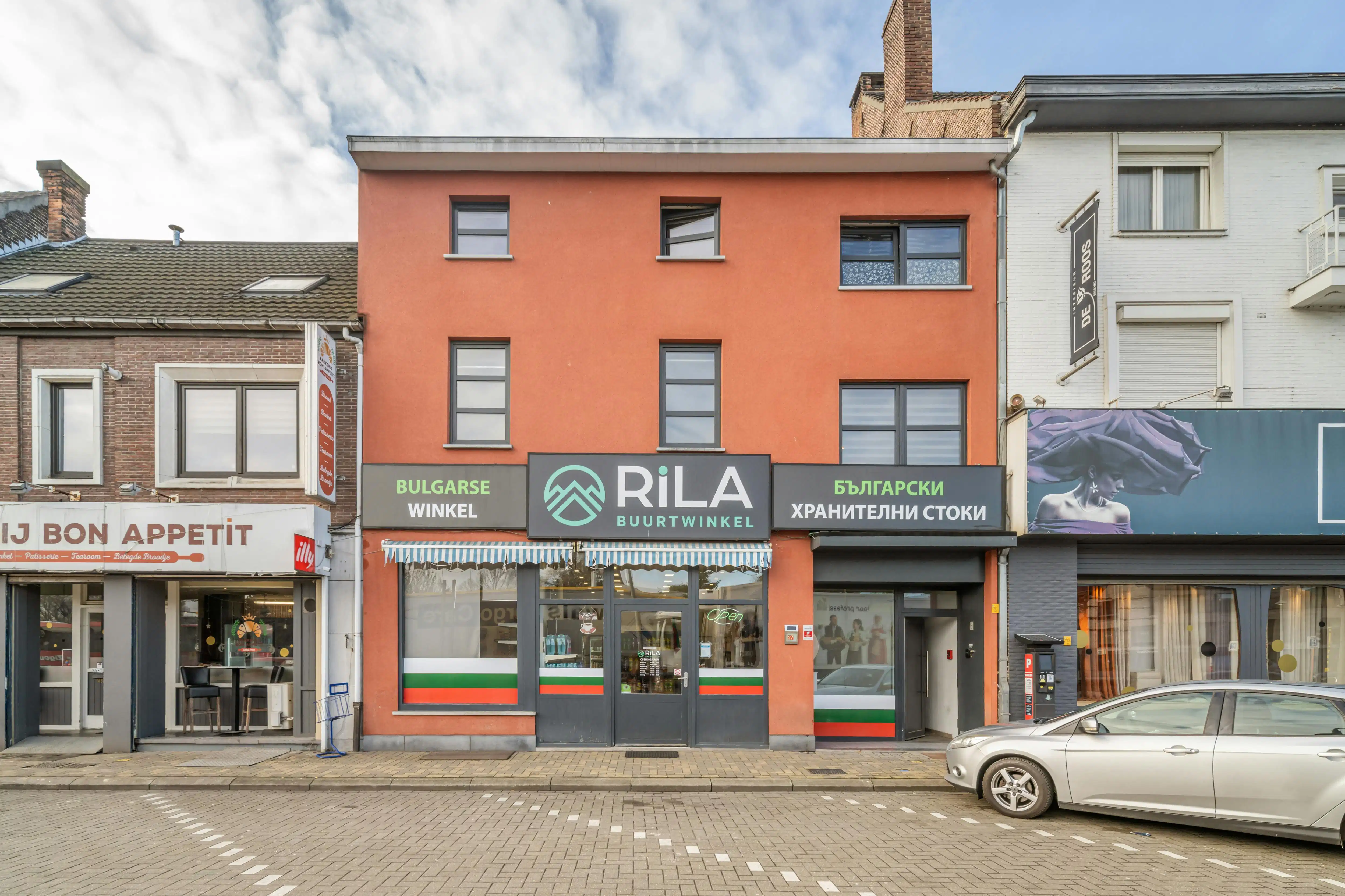 Rendabele opbrengsteigendom met handelspand, magazijn, woonst en 2 appartementen in Genk foto {{pictureIndex}}