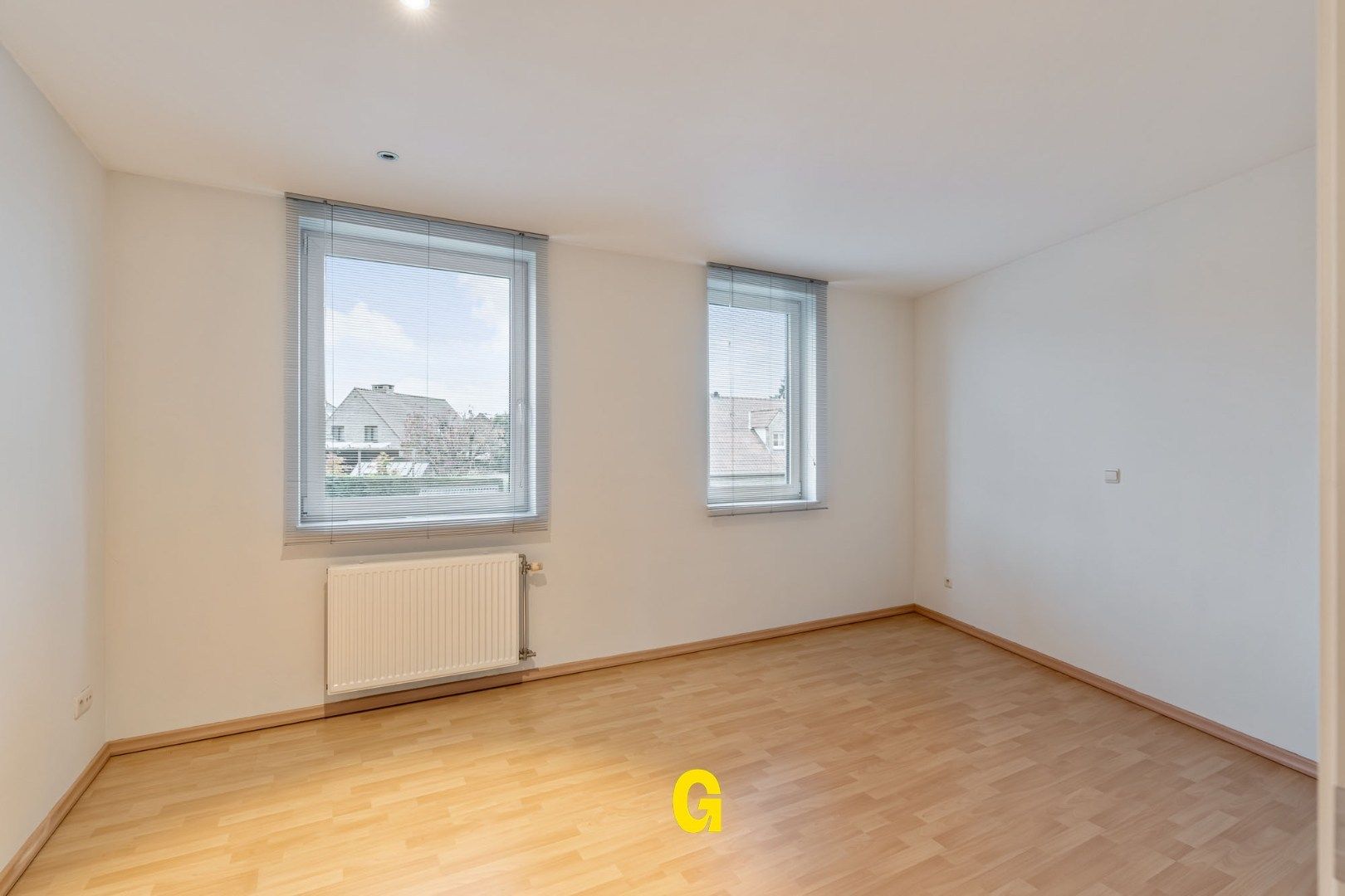 Degelijke instapklare rijwoning met drie slaapkamers, inpandige garage en tuin met terras vlakbij het centrum van Bilzen foto 23