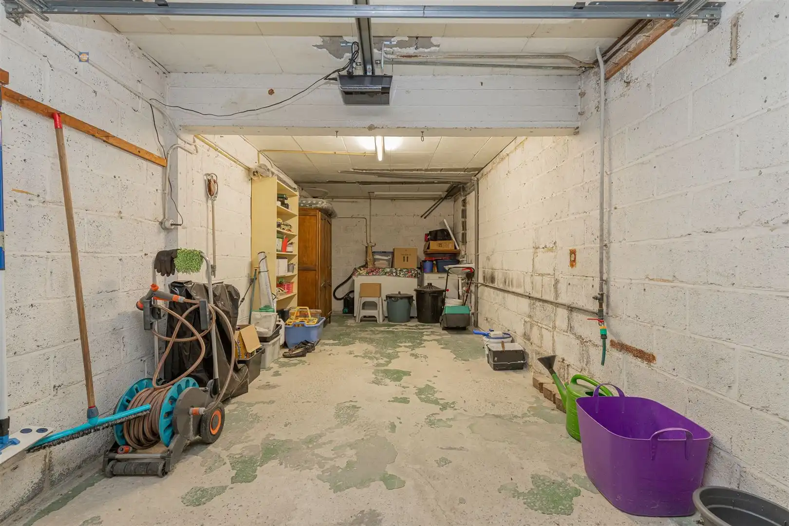 Gelijkvloers 2-slaapkamerappartement met tuin en garage foto 16