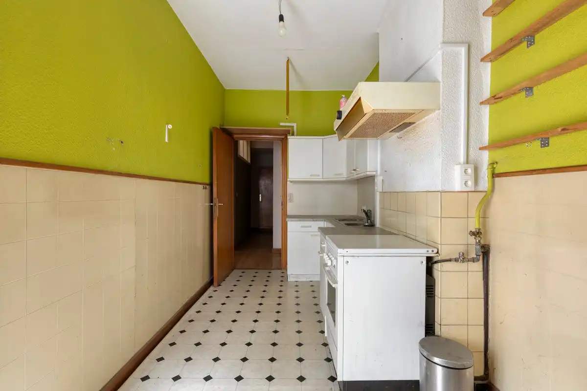 Opbrengsteigendom met renovatiepotentieel op toplocatie in Kortrijk foto 13