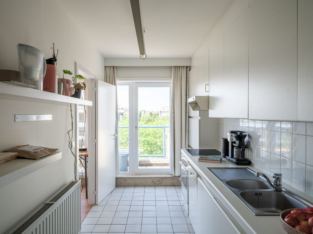 Licht op te frissen penthouse met 4 slaapkamers, meerdere zonneterrassen en een adembenemend uitzicht over de Leie en de Bijloke. Aankoop staanplaats. foto 8