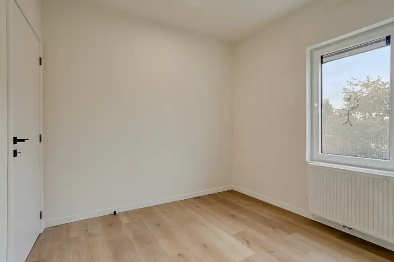 Ruime en instapklare woning met 4 slaapkamers en tuin foto 9