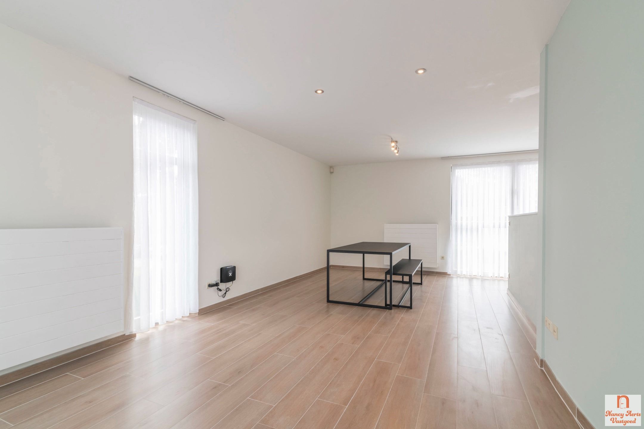 Lichtrijk duplexappartement met grote kelder en mega terras foto 8