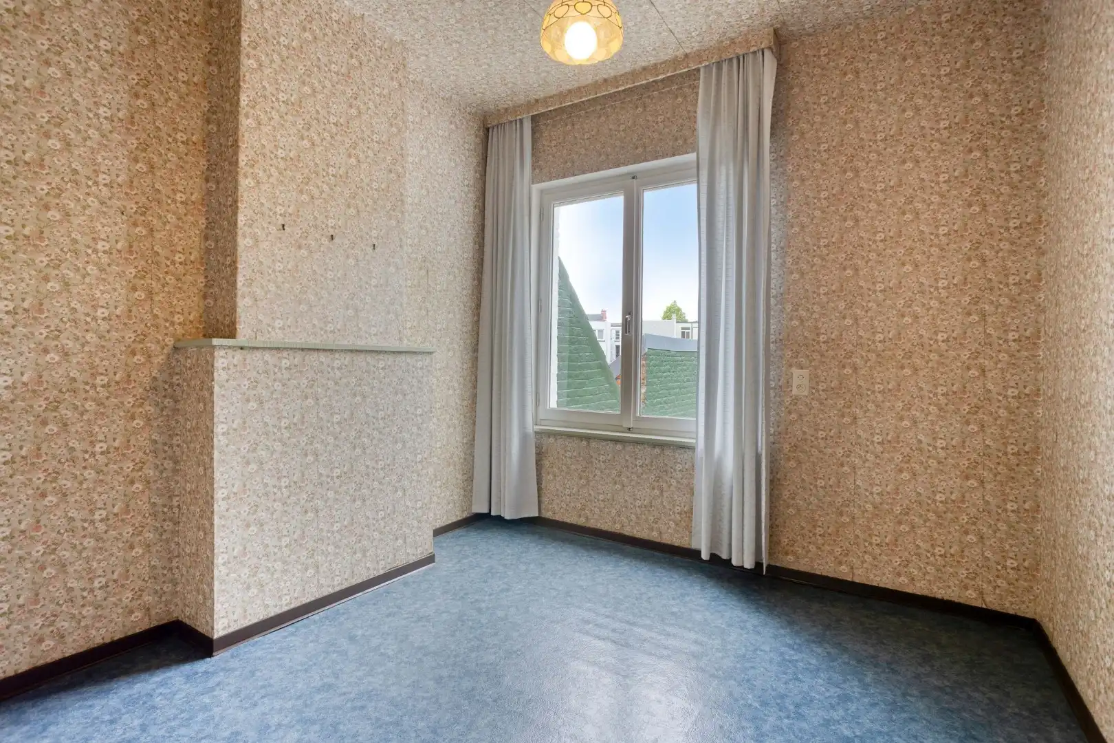 Te renoveren woning met tuin en garage in het centrum van Menen! foto 13
