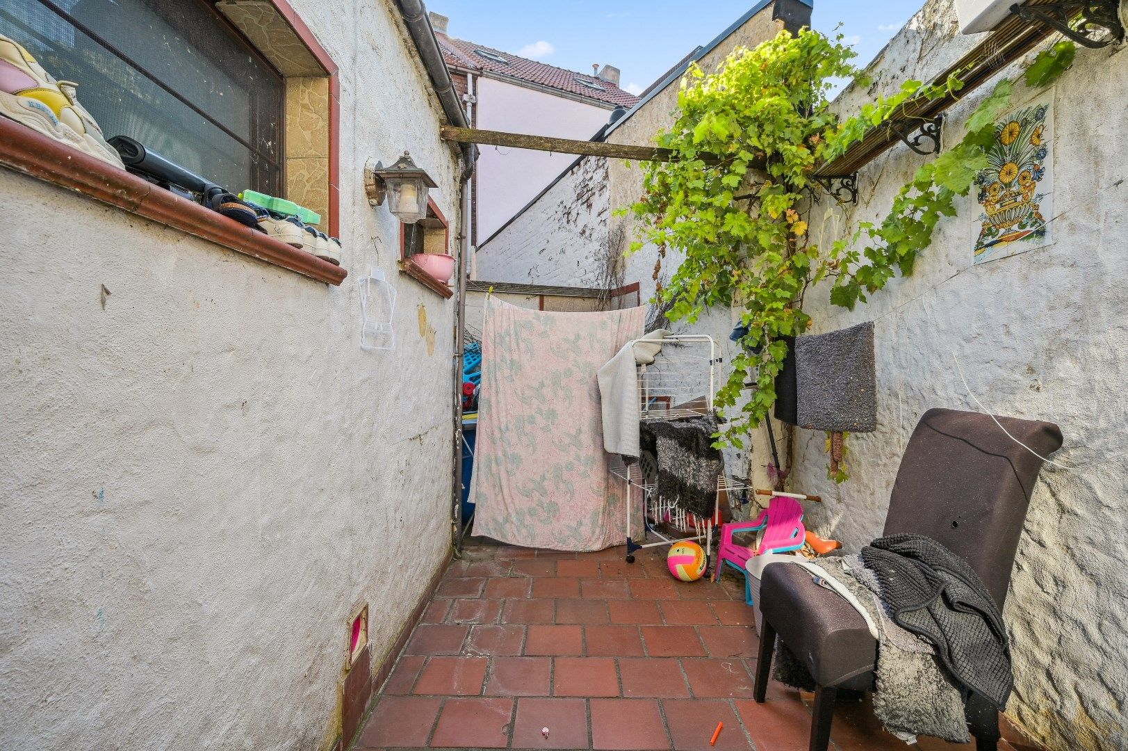 Te renoveren rijwoning met potentieel in de buitenrand van Tienen foto 14