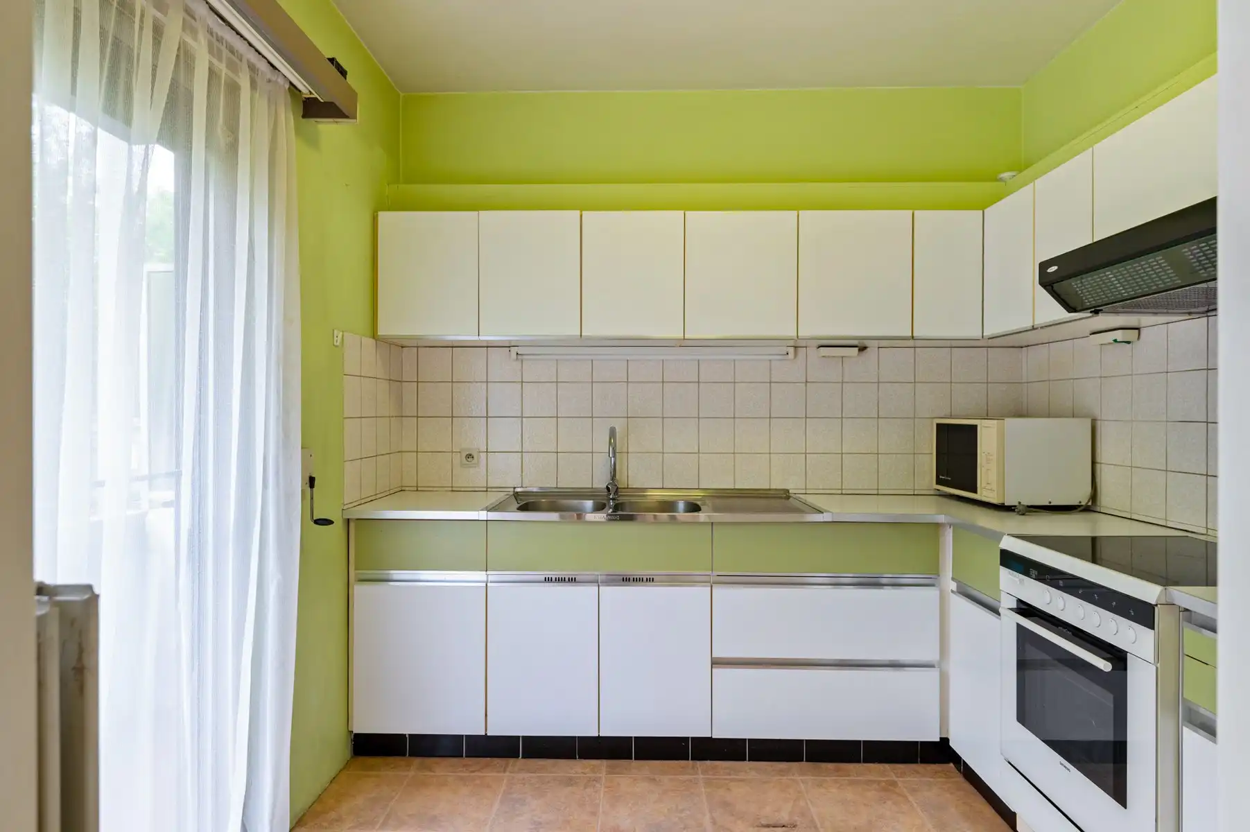 Te renoveren appartement met garage op uitstekende ligging foto 6