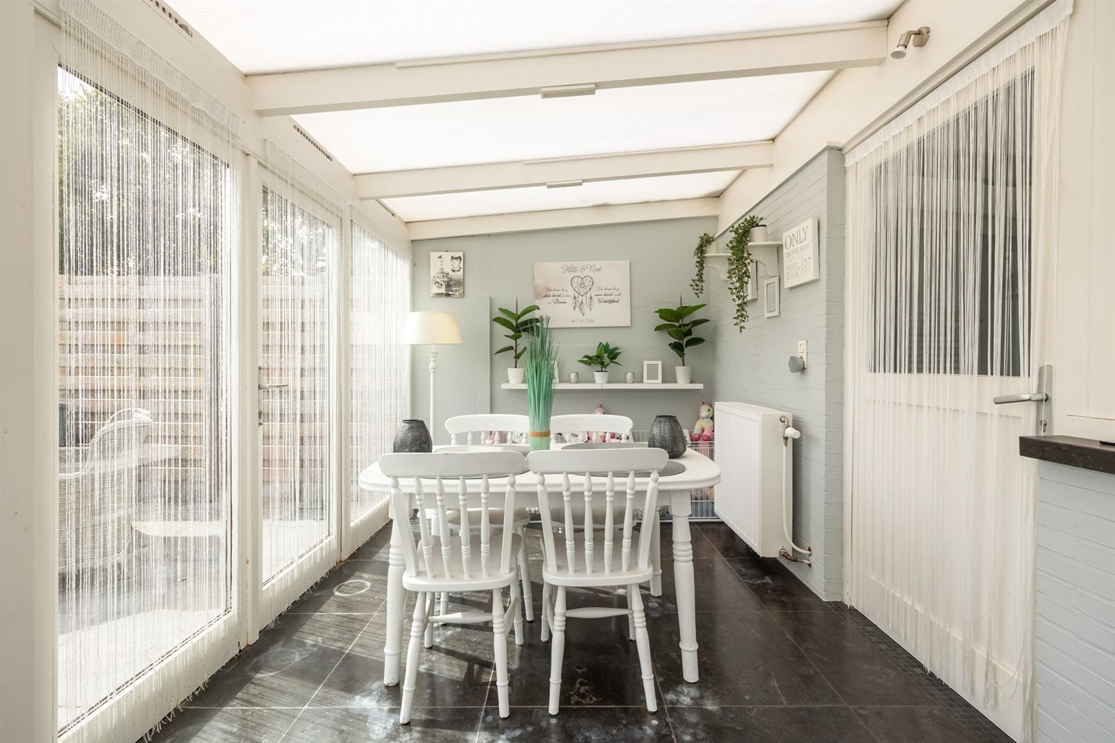 Instapklare halfopen woning met zonnige tuin aan de Vaart Schoten foto 10