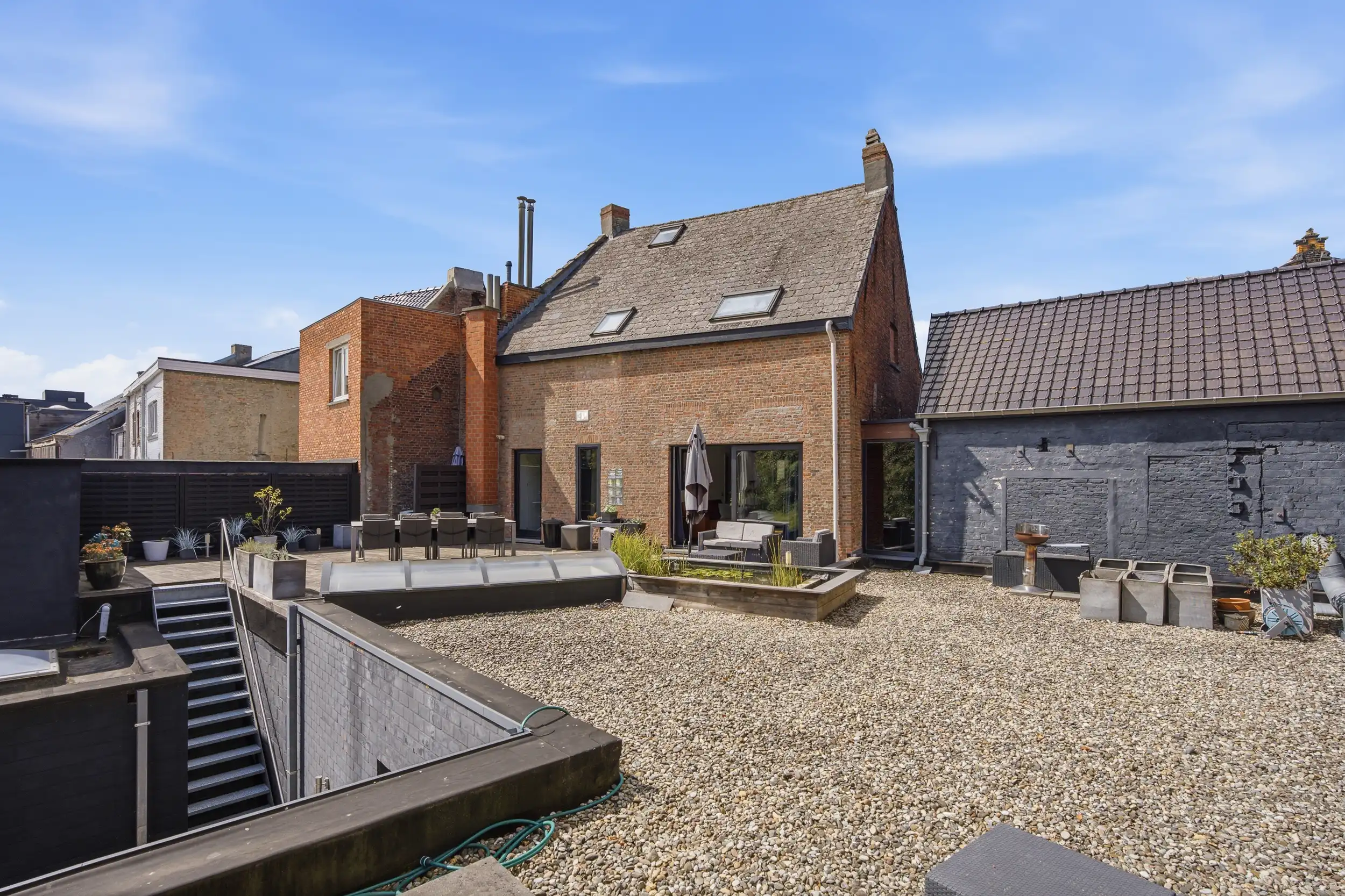 Uniek handelspand met duplex app. en tuin in hartje Wetteren foto 21