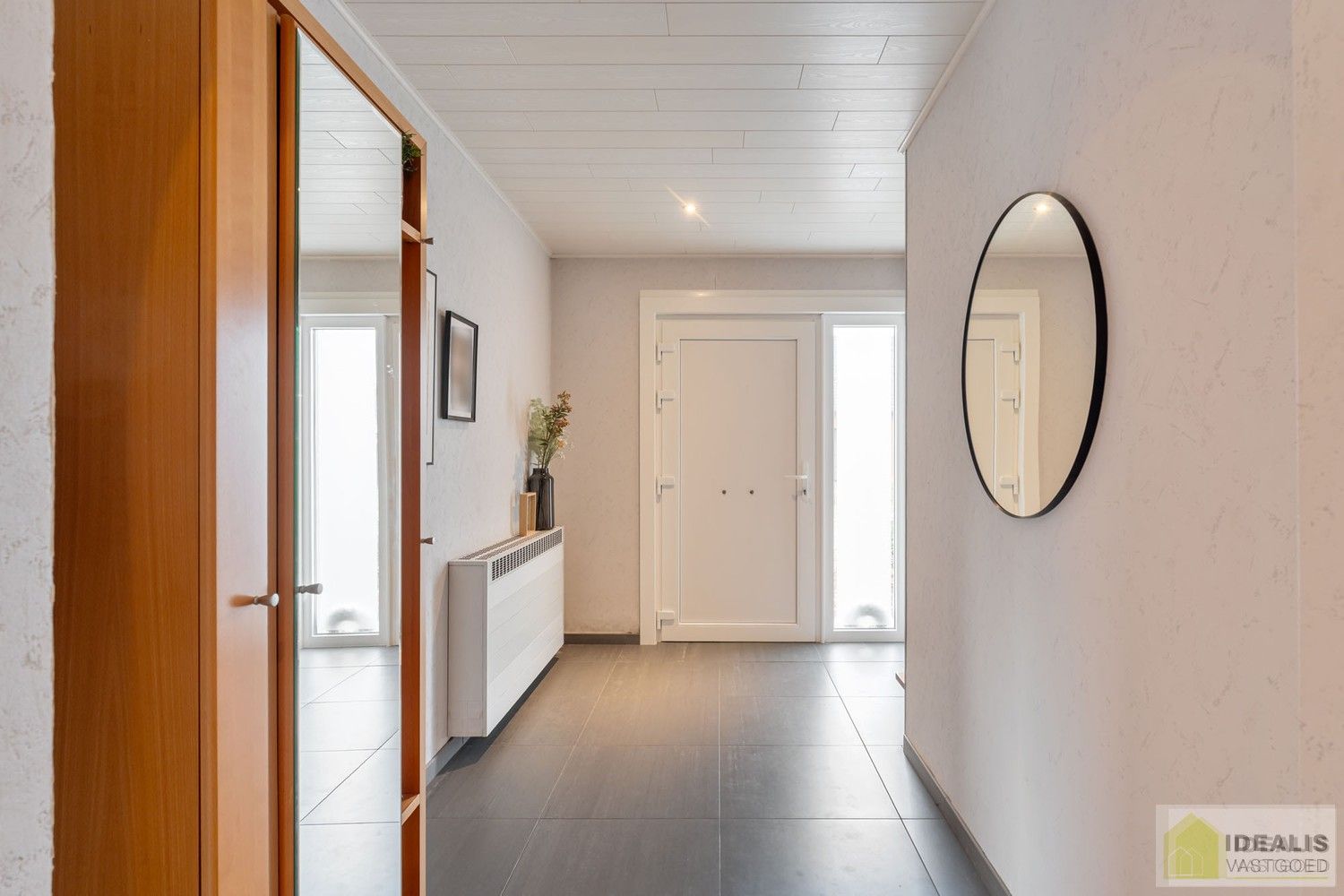 IDEALIS VASTGOED – Instapklare eengezinswoning met een lichtrijke leefruimte, 3 ruime slaapkamers (mogelijks 4), 2 badkamers op een fijn zuid-oost georiënteerd perceel! Deze woning bevindt zich op een perceel van 5a 19ca in een rustige en gezinsvriendelijke woonstraat! foto 5