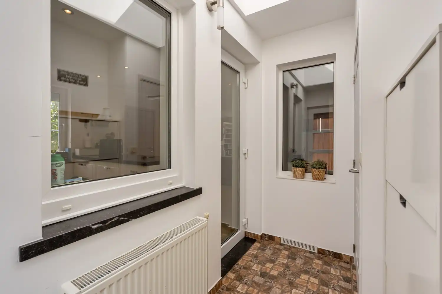 Landelijk gelegen, instapklare woning met 4 slaapkamers en zuidwestgerichte tuin op 8a27ca te Lubbeek. foto 11