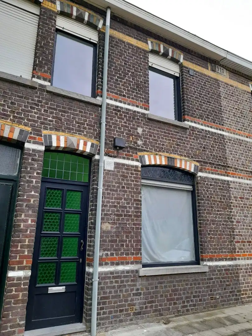 Op te frissen rijwoning met tuin, garage en 2 slaapkamers te Marke foto 2