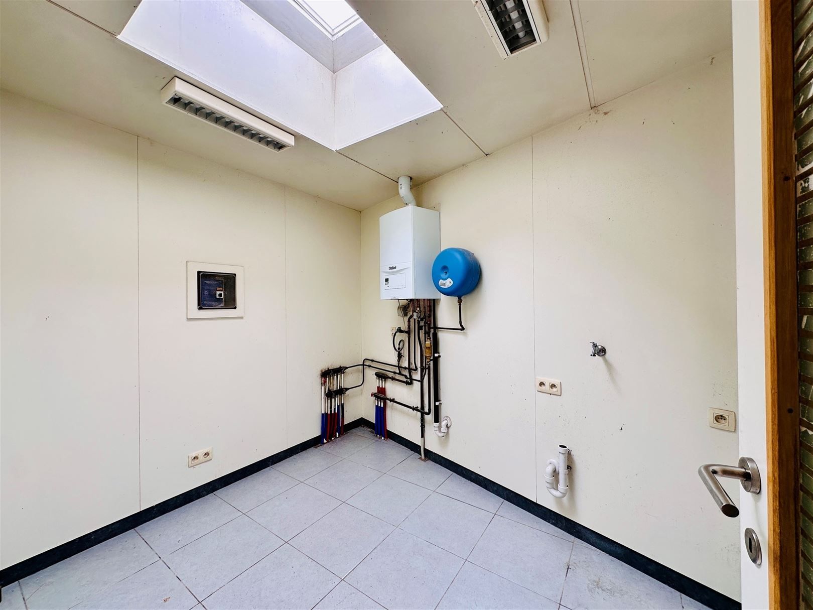 Ruime woning met diepe tuin in Grembergen met mogelijkheid tot handel of zelfstandige activiteit foto 10