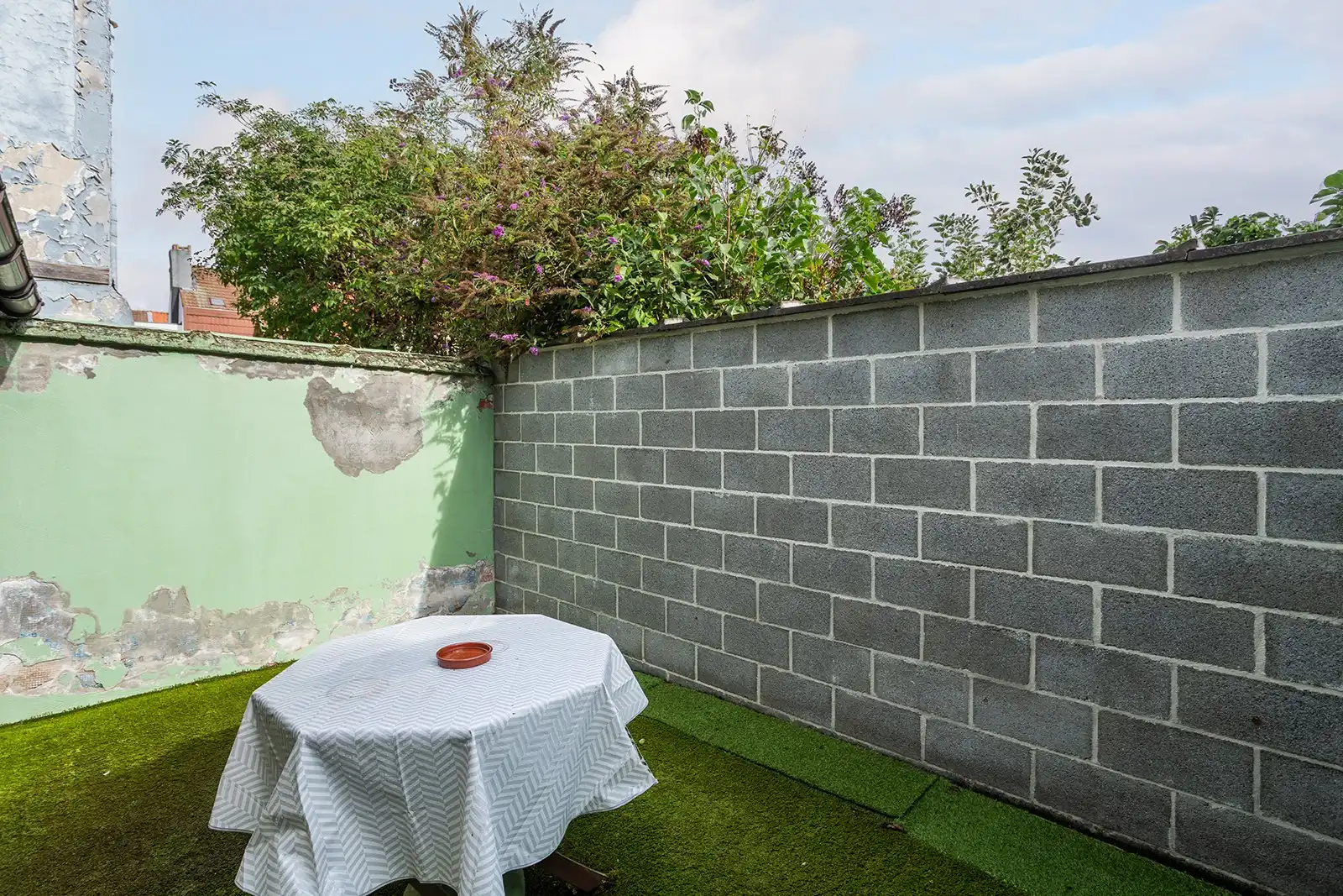 Woning met veel potentieel en zuidwestgerichte stadskoer  foto 18
