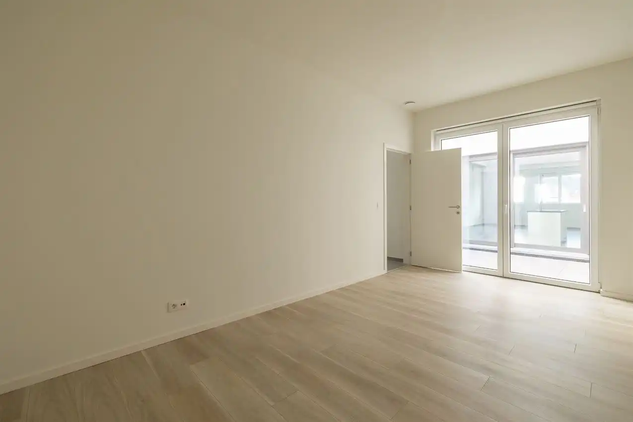 Nieuwbouwappartement met 1 slpk, autostaanplaats en terras foto 9