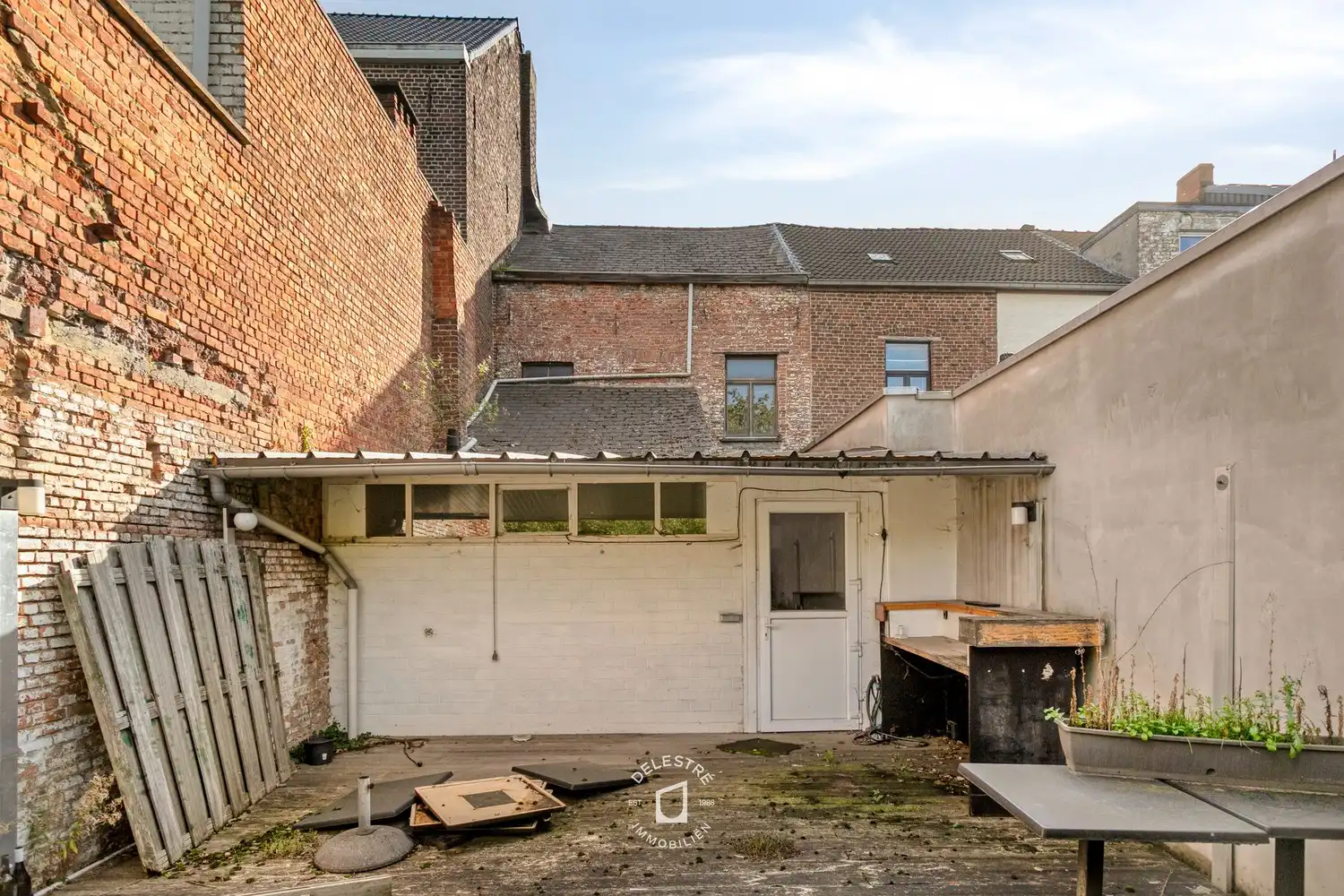 Veelzijdig renovatie- of herbestemmingsproject met zonnige stadstuin in vernieuwde Gentsestraat foto 16