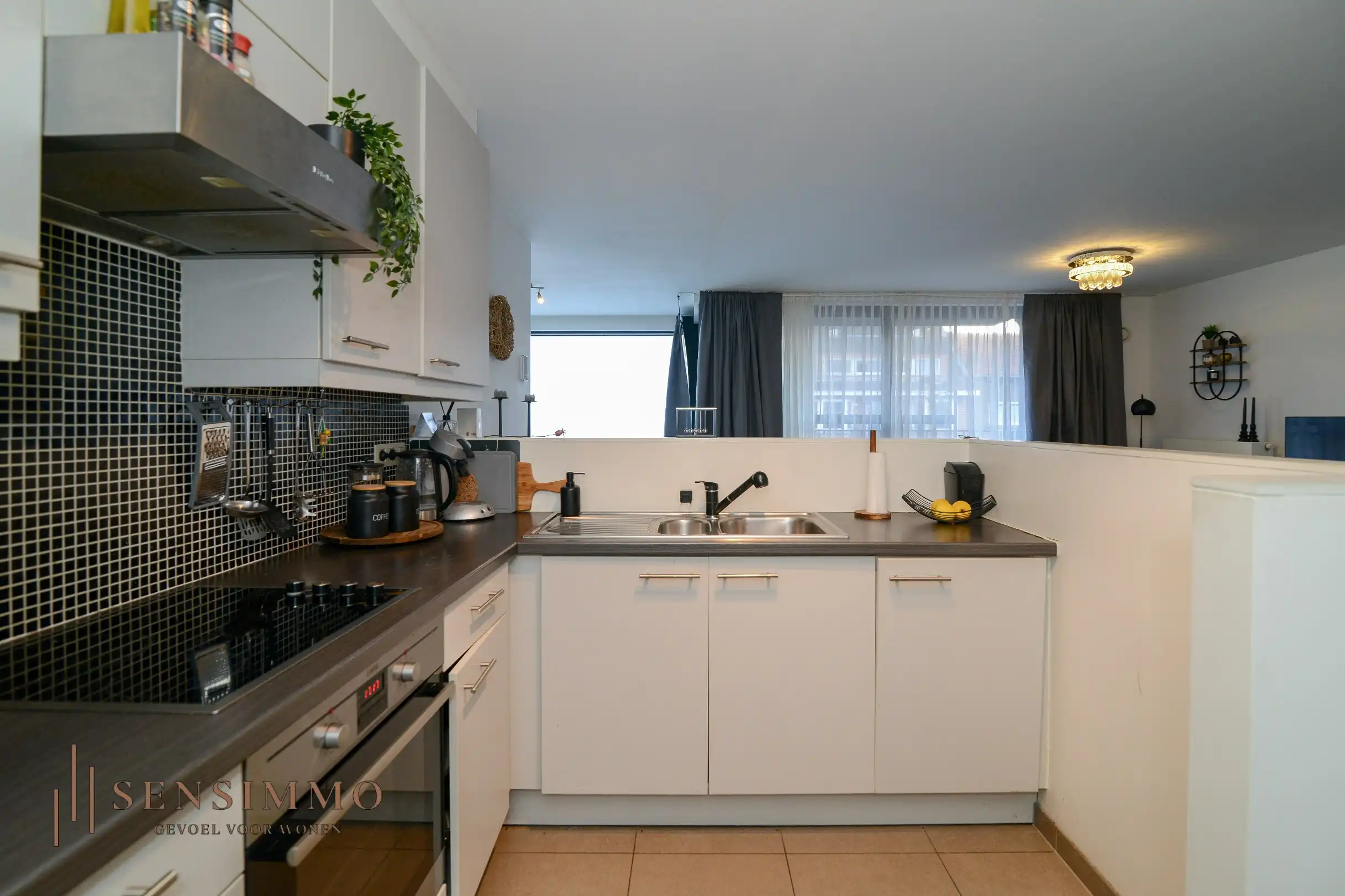 Instapklaar 2-slaapkamerappartement met dubbele terrassen en garagebox in hartje Eisden foto 8