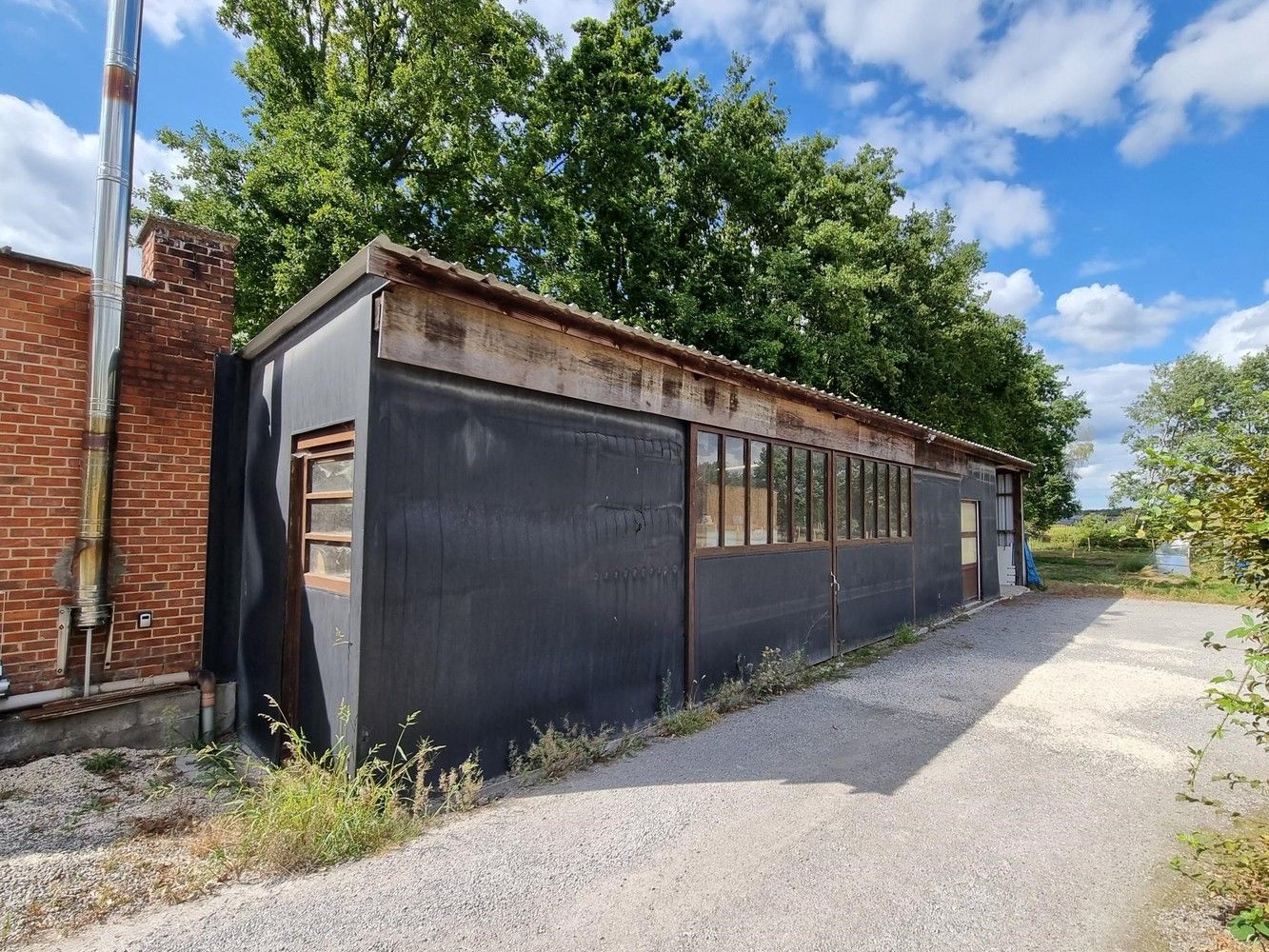 Woning met achterliggend magazijn op een totaal perceel van 19 are 58 ca. foto 5