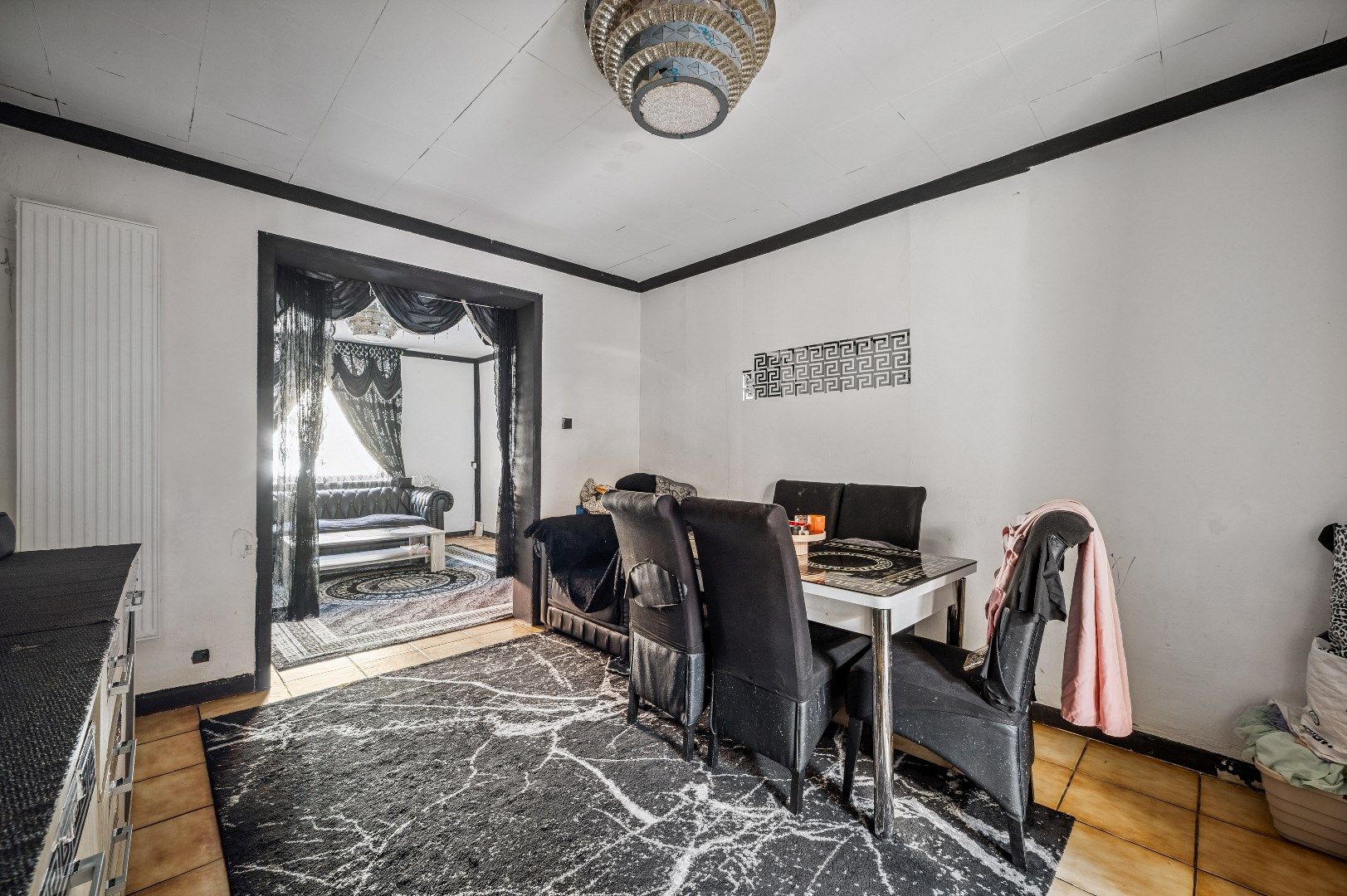 Te renoveren rijwoning met potentieel in de buitenrand van Tienen foto 5