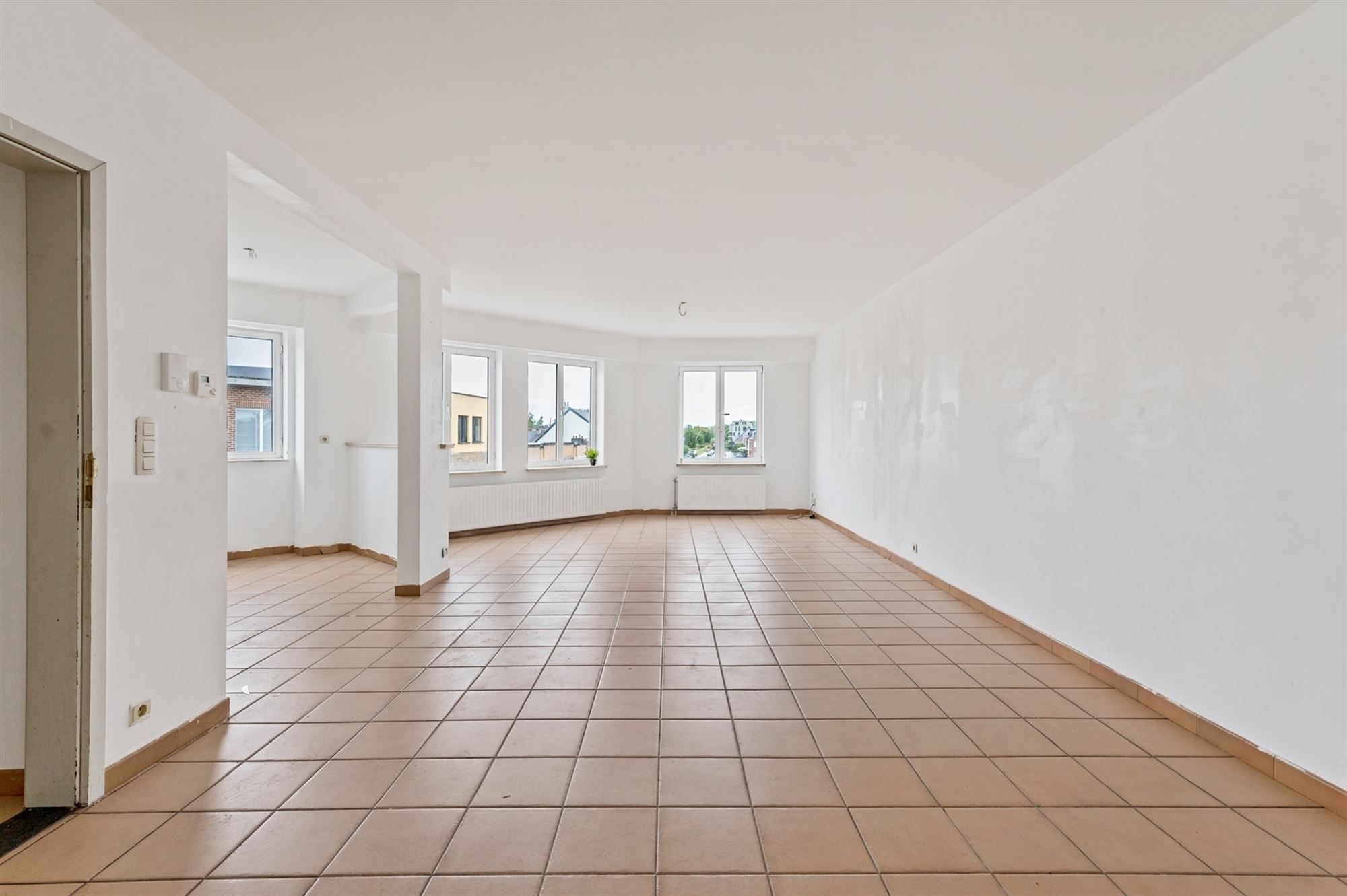 Opbrengsteigendom - 2 appartementen + handelspand te Lier foto 2