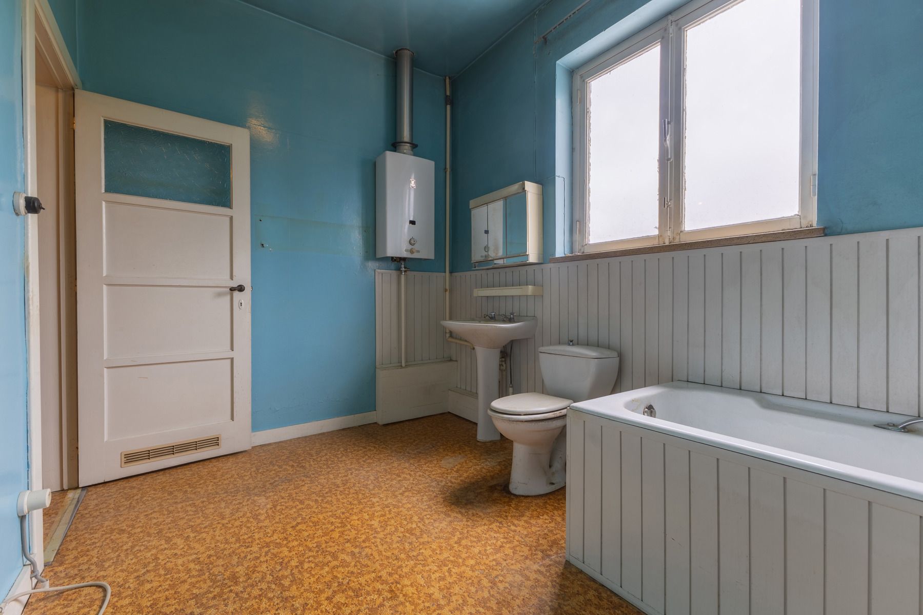 Gunstig gelegen te renoveren driegevelwoning foto 20
