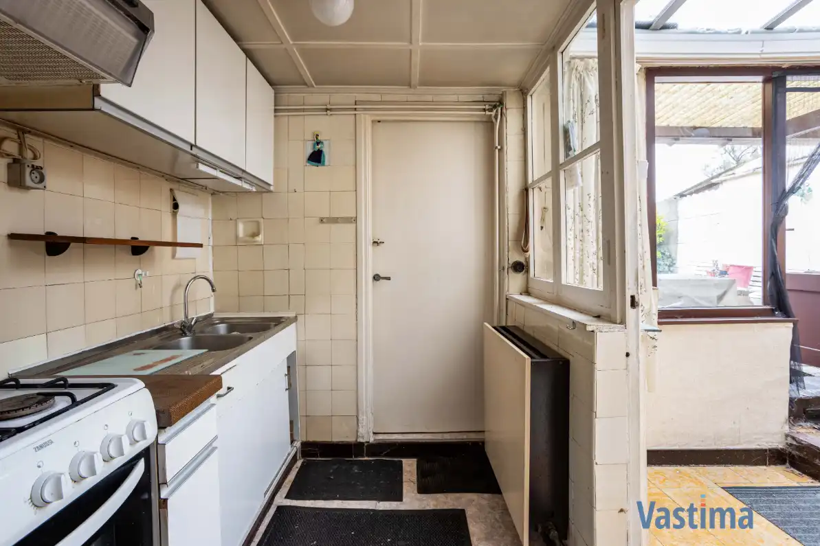 Te renoveren woning met tuin nabij OLV-Ziekenhuis foto 10