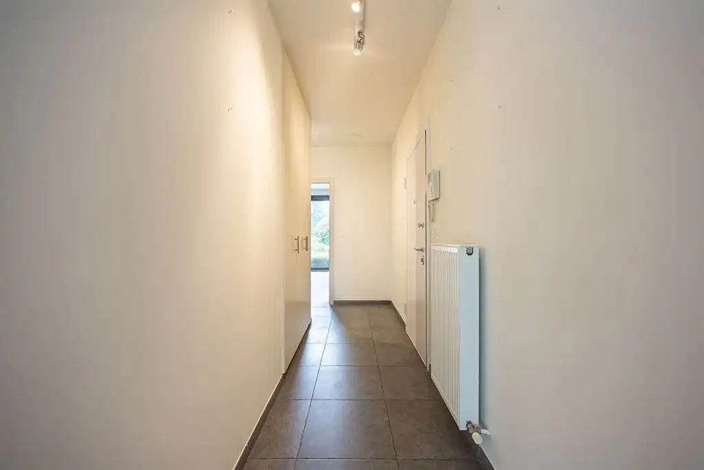 Instapklaar gelijkvloers appartement met tuin foto 11