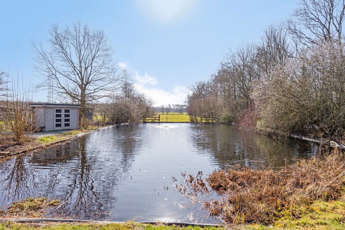 Goed onderhouden ruim ingedeelde woning op 11.725 m². foto 32