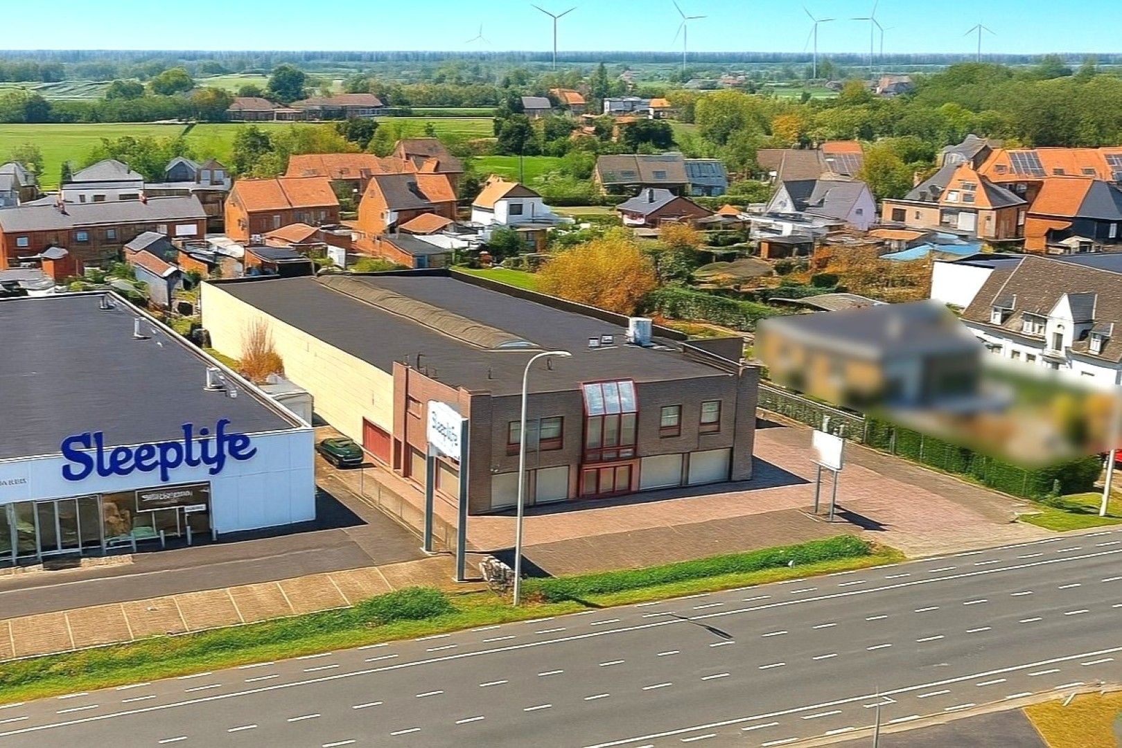  veelzijdig bedrijfsgebouw met woonst op een absolute commerciële topligging foto 2