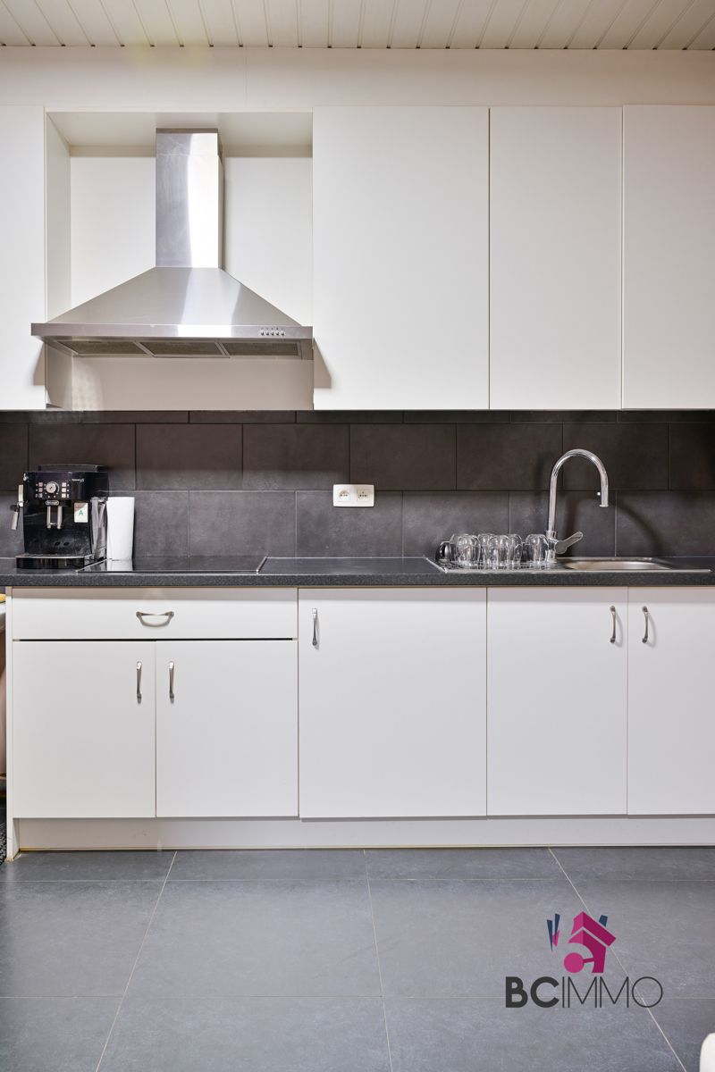 Handelswoonst met een triplex appartement te koop in Genk foto 22
