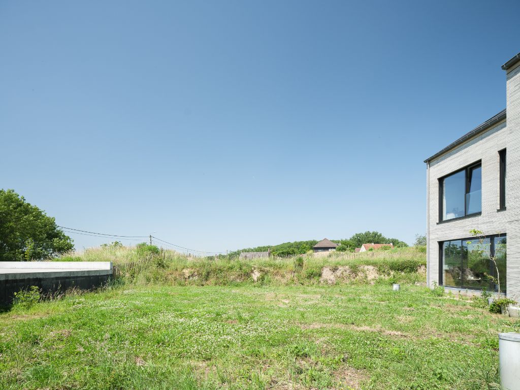 Architecturale casco-nieuwbouw bestaande uit een uitzonderlijke stapelwoning met onderliggende garage en adembenemende zichten over de Scheldevallei. foto 24