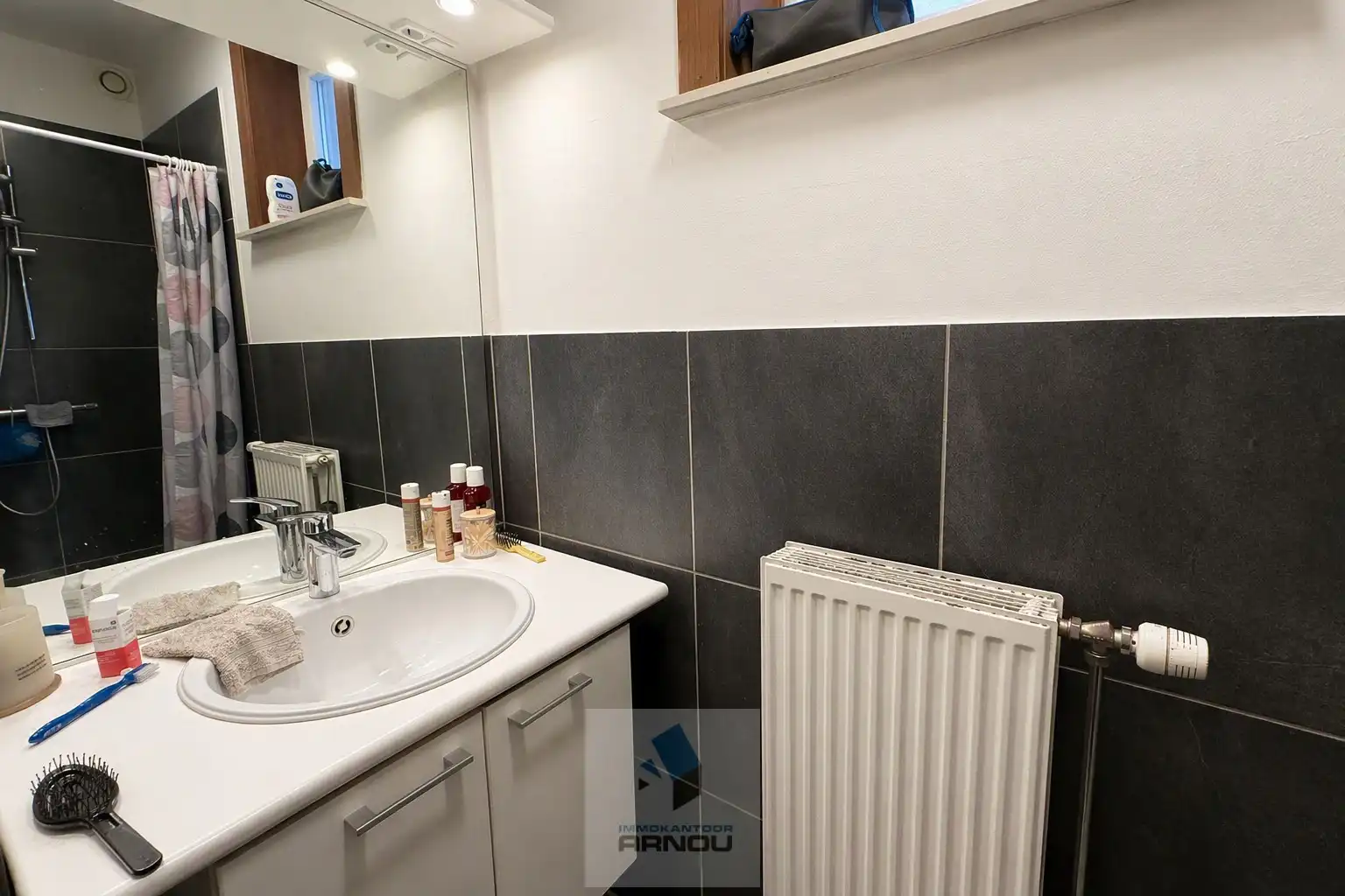 Gezellig gelijkvloers appartement met 1 slaapkamer, stadstuintje en privatieve autostaanplaats foto 11